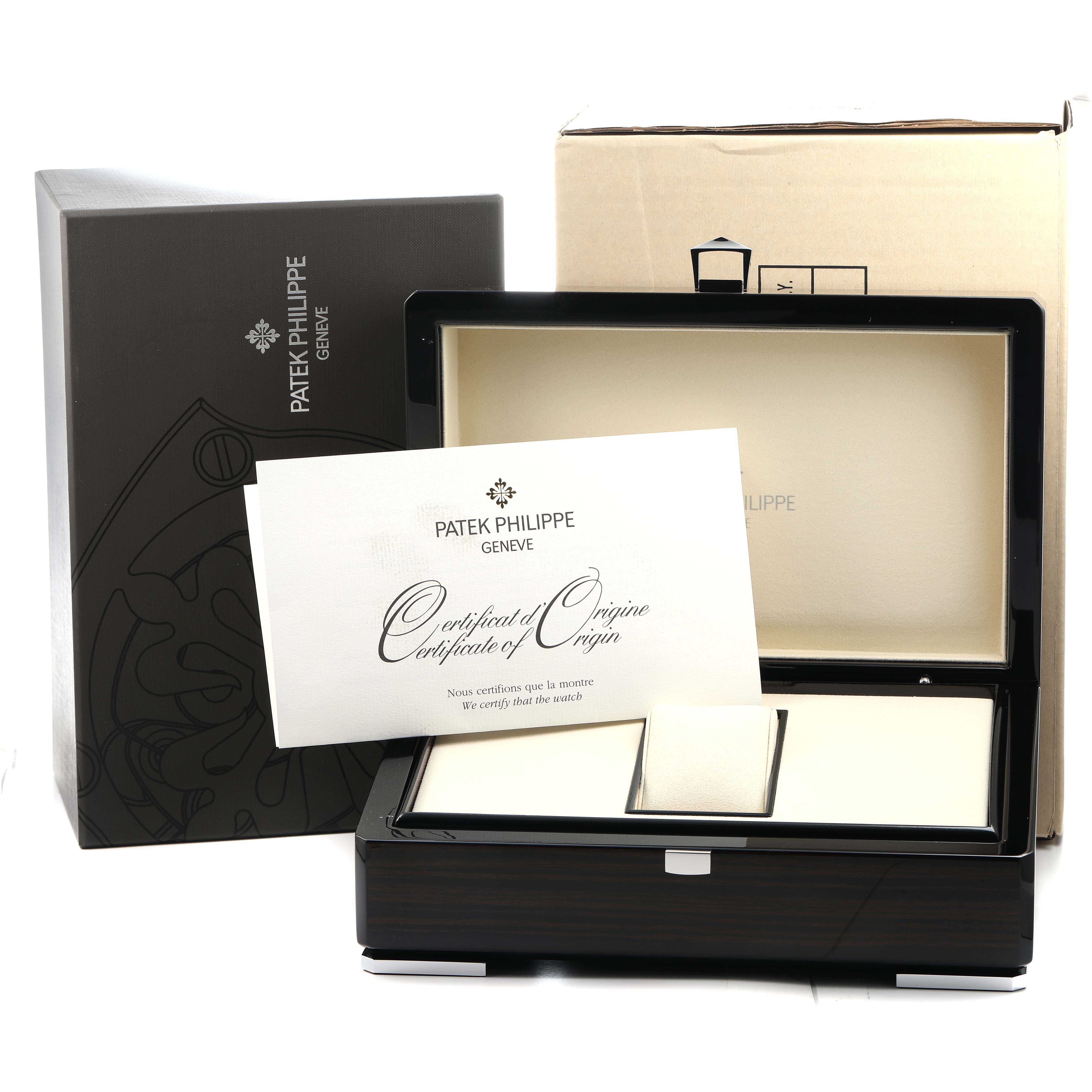 The image shows the Patek Philippe Nautilus 5712G Men's White Gold Grey Dial watch box, certificate, and packaging from a front angle.