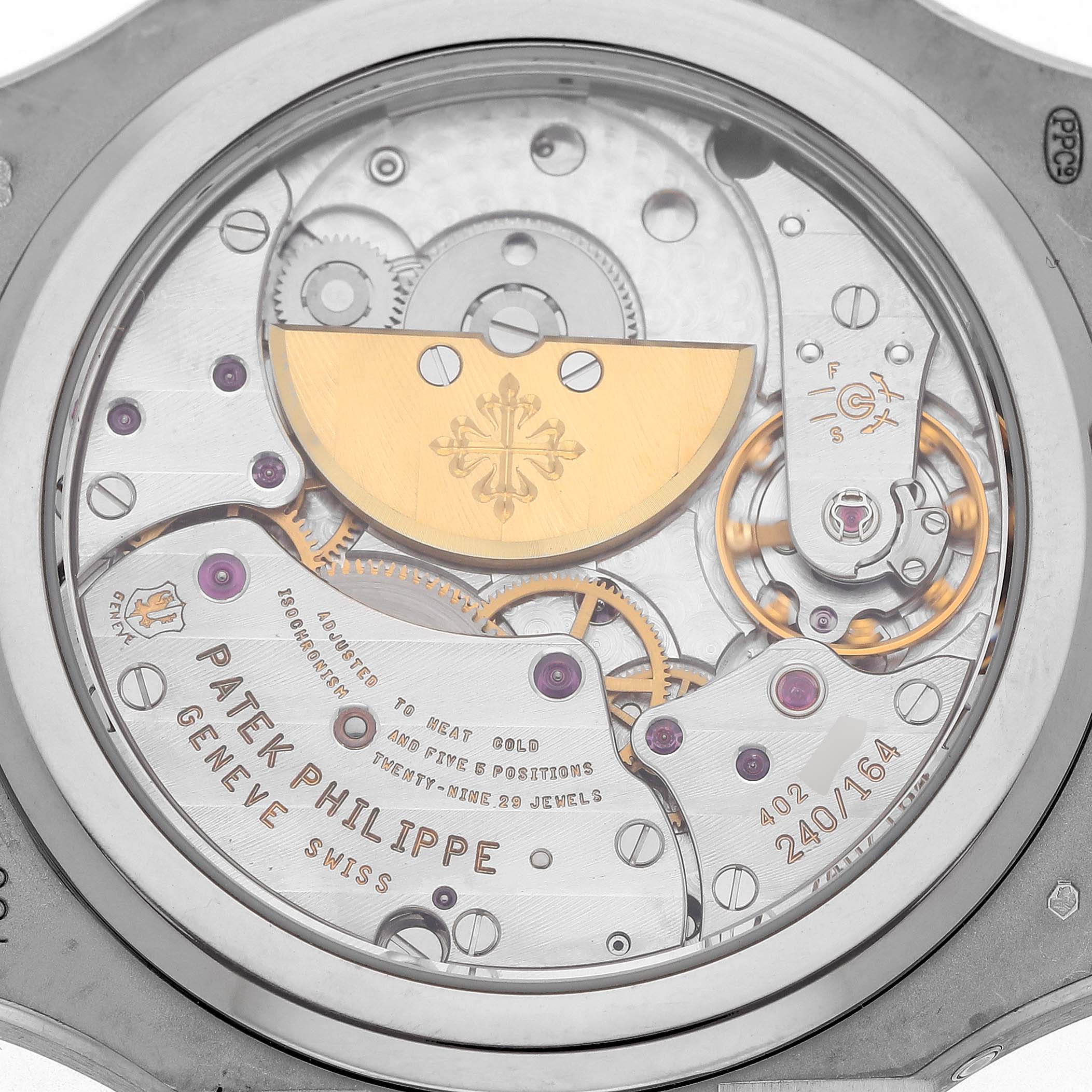 The image shows the back view of the Patek Philippe Nautilus 5712G Men's White Gold Grey Dial, highlighting the movement and rotor.