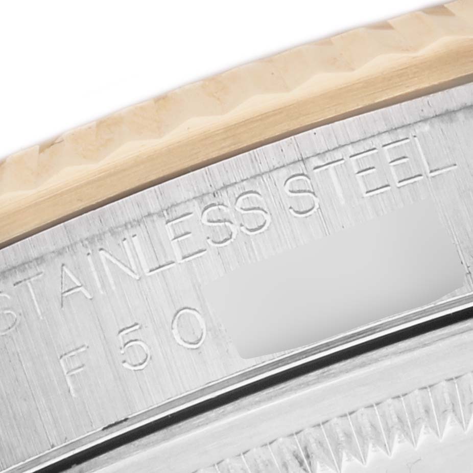 The image shows a close-up of the side of a Rolex Datejust 16233 Men's Steel and Gold (two tone) Black Dial 16233 Men's Steel and Gold (two tone) Black Dial watch, highlighting the text "STAINLESS STEEL" and part of the bezel.