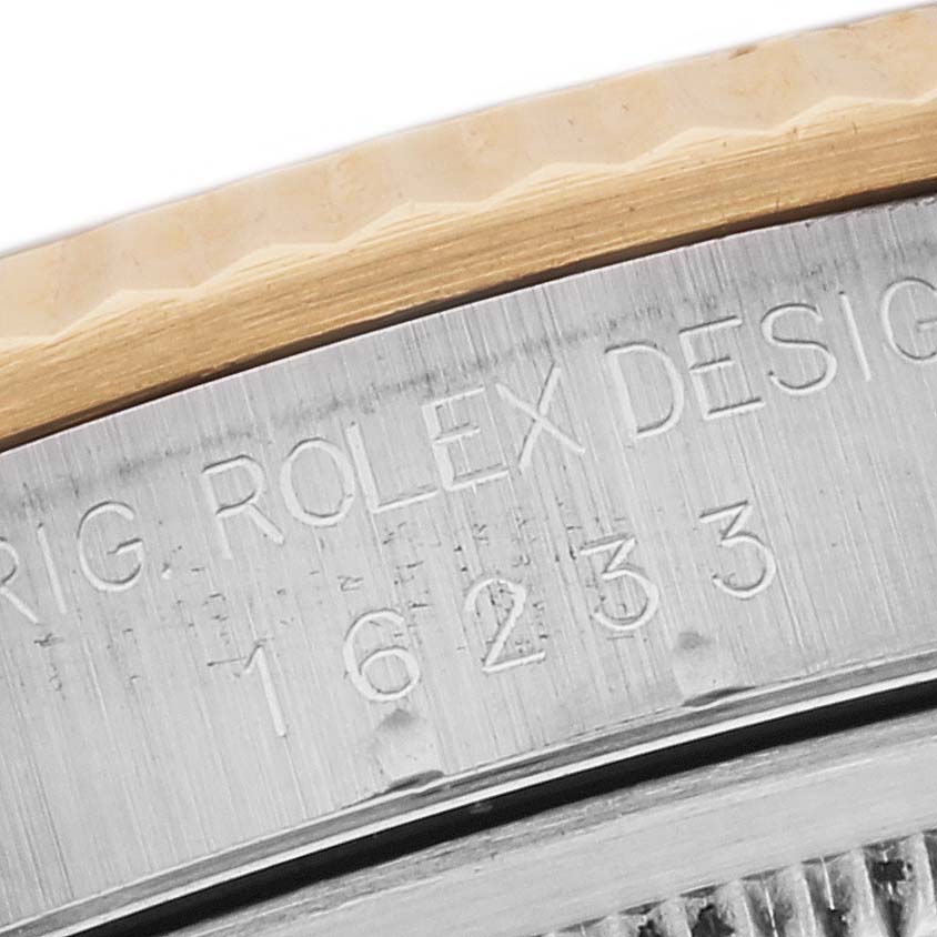 The image shows a close-up of the bezel and engraved serial number "16233" on a Rolex Datejust 16233 Men's Steel and Gold (two tone) Black Dial 16233 Men's Steel and Gold (two tone) Black Dial watch.