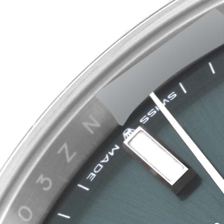 The image shows a close-up of the dial and outer edge of the bezel on a Rolex Datejust 41 126334 Men
s Stainless Steel Green Dial 126334 Men
s Stainless Steel Green Dial watch.