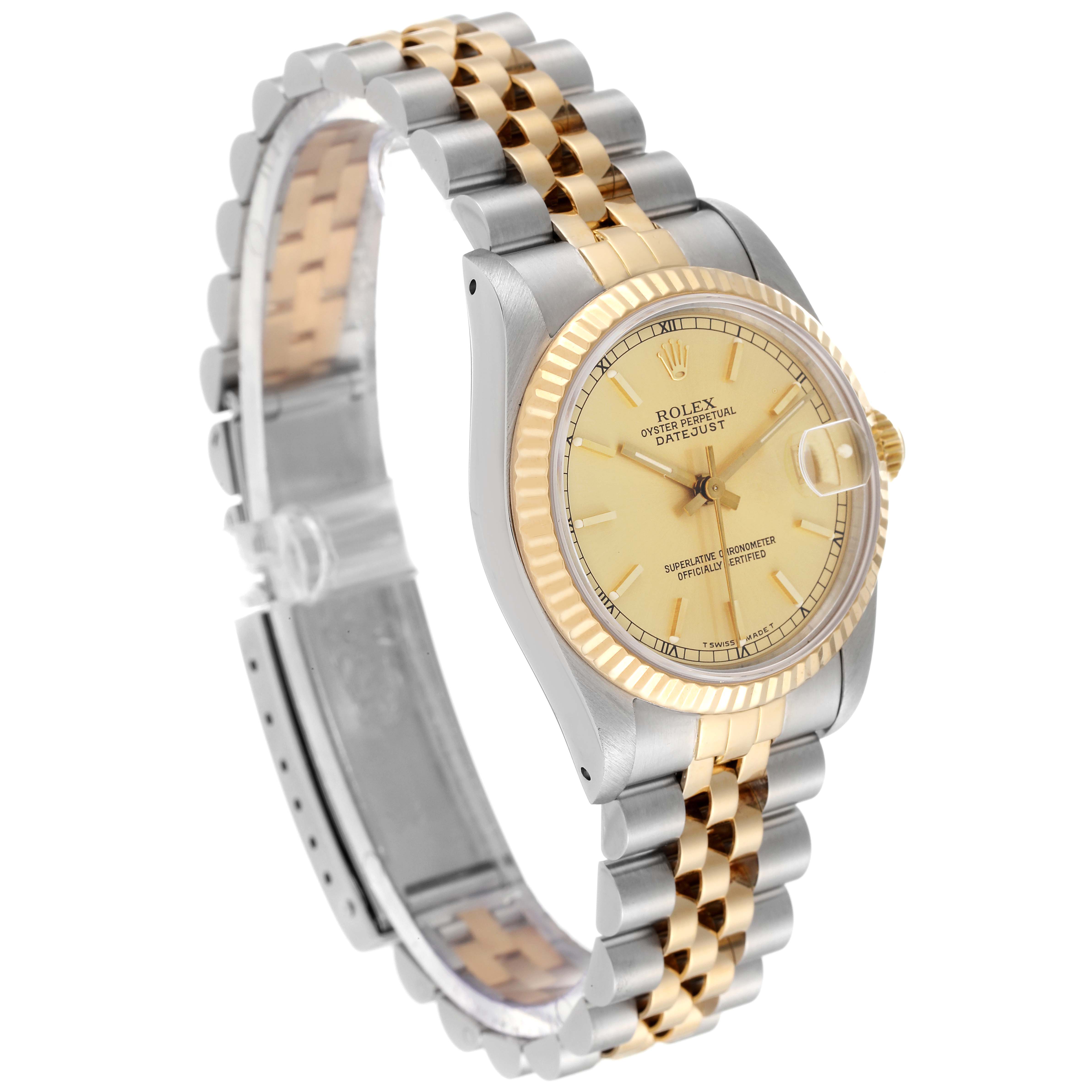 The image shows a three-quarter angle of a Rolex Mid-Size 68273 Women
s Steel and Gold (two tone) Champagne Dial 68273 Women
s Steel and Gold (two tone) Champagne Dial Oyster Perpetual Datejust watch, highlighting its face, bezel, and bracelet.