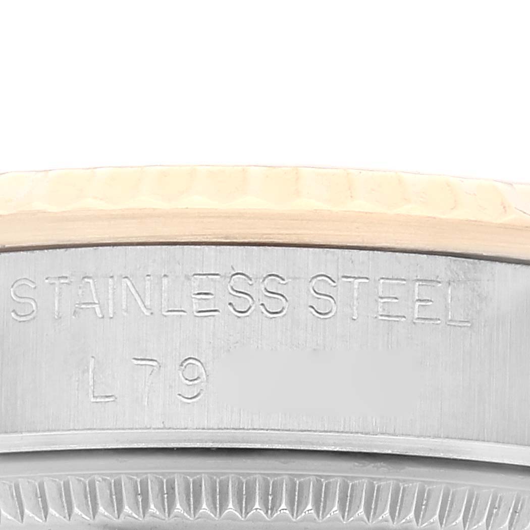 The image shows a close-up of the side of a stainless steel casing of a Mid-Size Rolex watch.