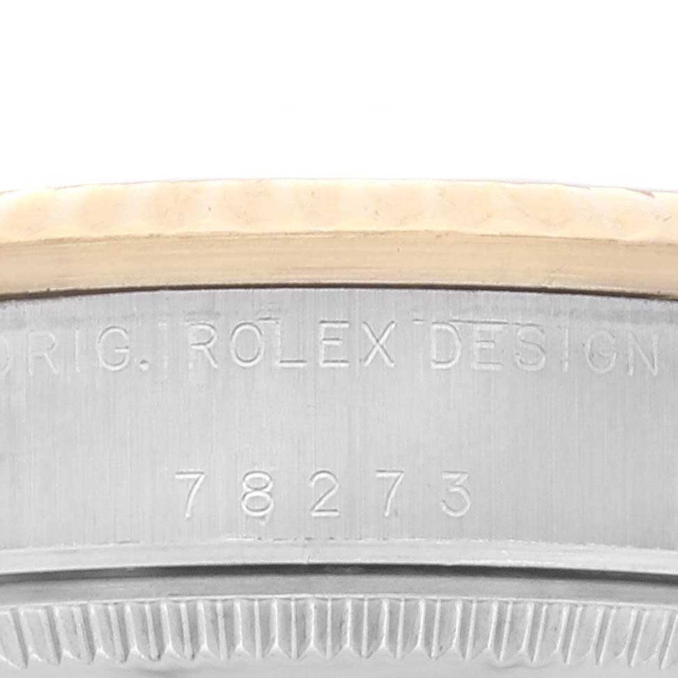The image shows a close-up of the case back, model number, and part of the bezel of a Mid-Size Rolex watch.