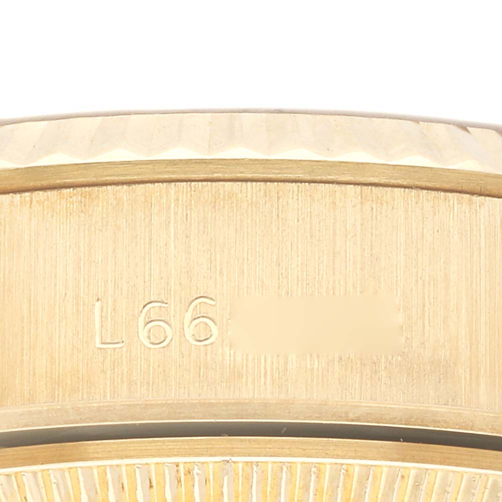 The image shows a close-up of the case side, bezel, and serial number inscription of a Rolex President 69178 Women
s Yellow Gold Champagne Dial 69178 Women
s Yellow Gold Champagne Dial model watch.