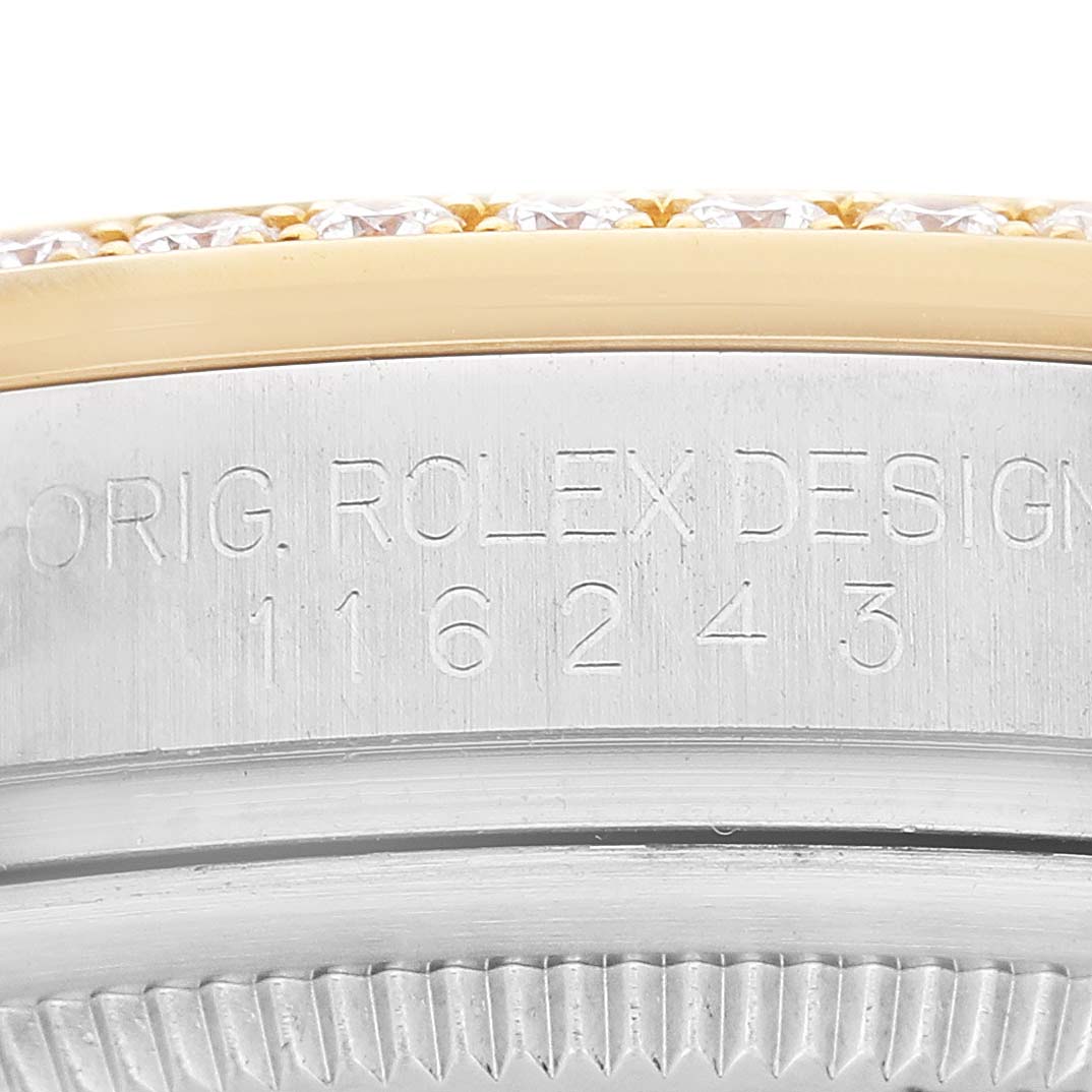 The image shows a close-up of the engraved side edge of a Rolex Datejust 116243 Men's Steel and Gold (two tone) Silver Dial watch case, featuring its model number.