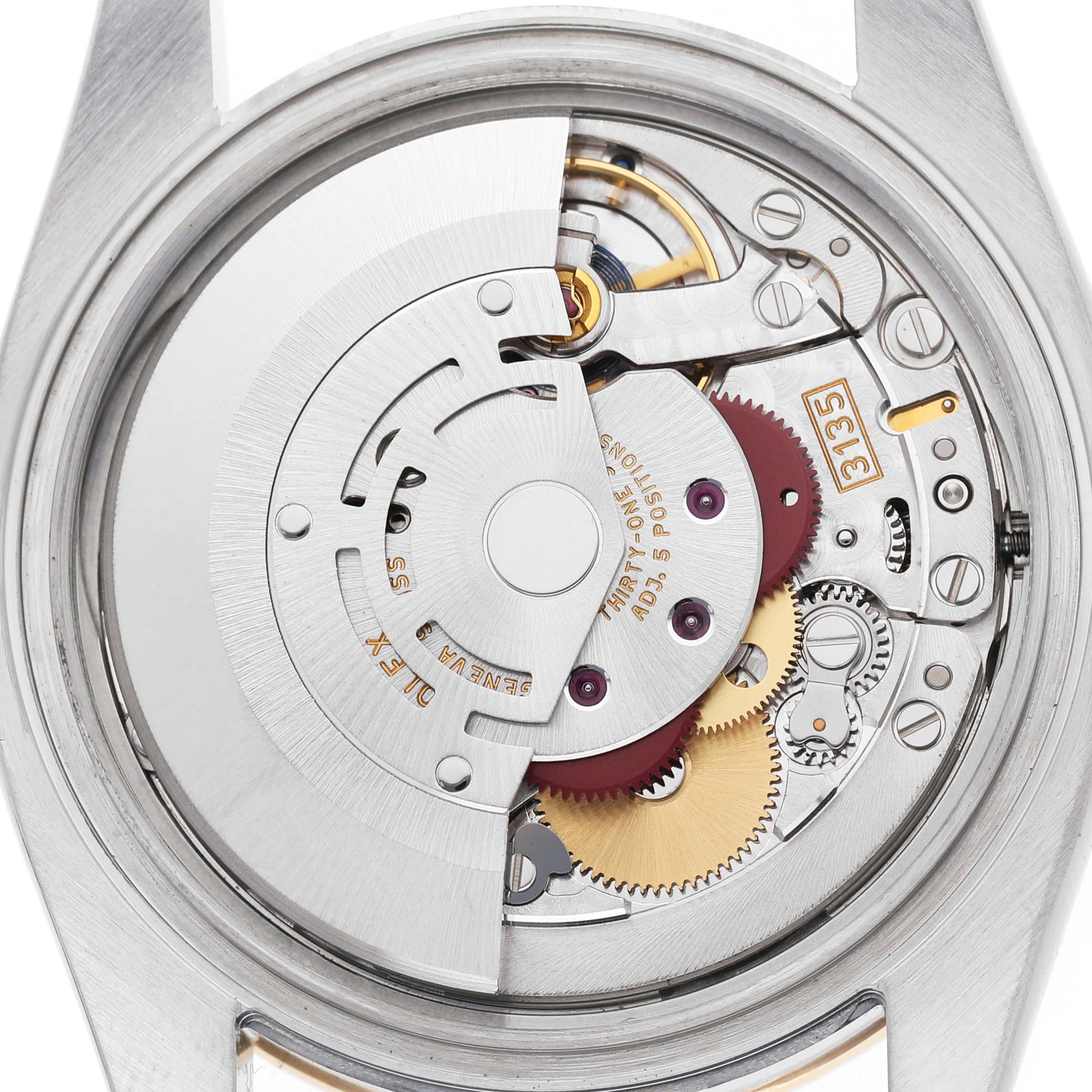 The image shows the back view of a Rolex Datejust 116243 Men's Steel and Gold (two tone) Champagne Dial, displaying its intricate mechanical movement and components.