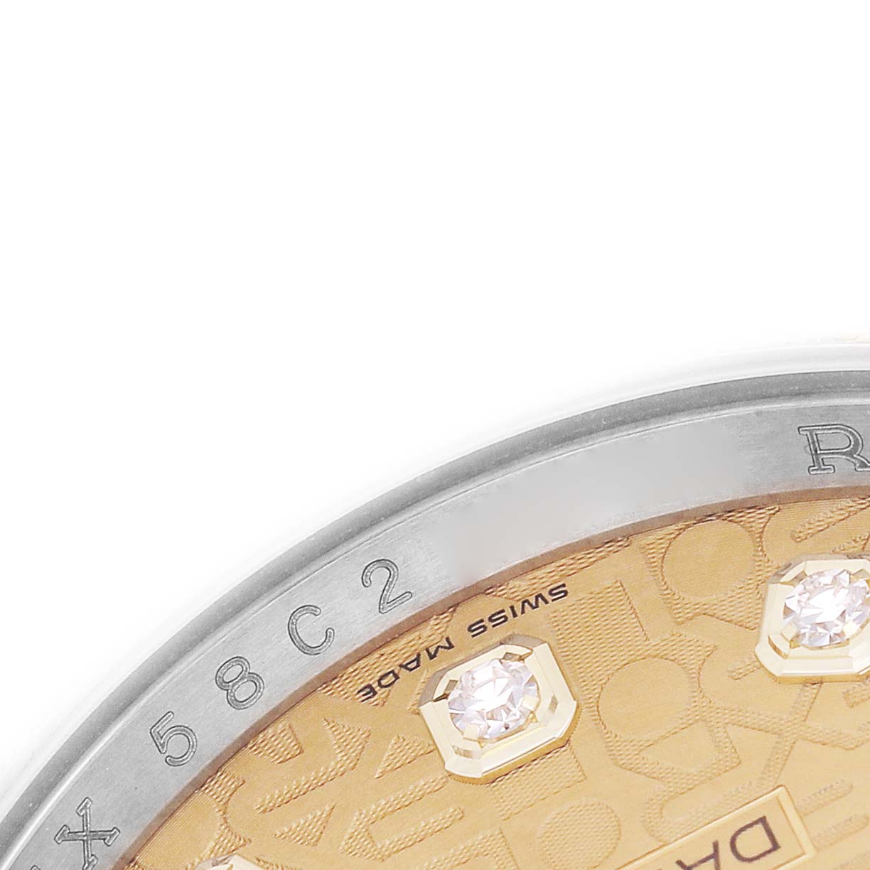 The image shows a partial close-up of a Rolex Datejust 116243 Men's Steel and Gold (two tone) Champagne Dial watch dial with diamond markers and side view of the bezel.