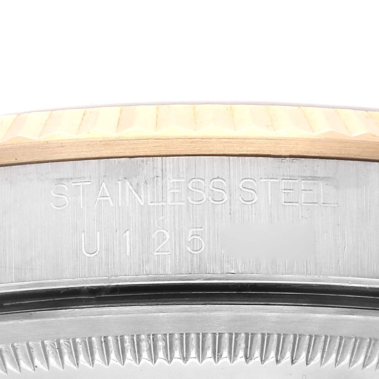 The image shows a close-up side view of the stainless steel casing of a Rolex Datejust 16233 Men's Steel and Gold (two tone) Black Dial 16233 Men's Steel and Gold (two tone) Black Dial watch, highlighting the serial number.