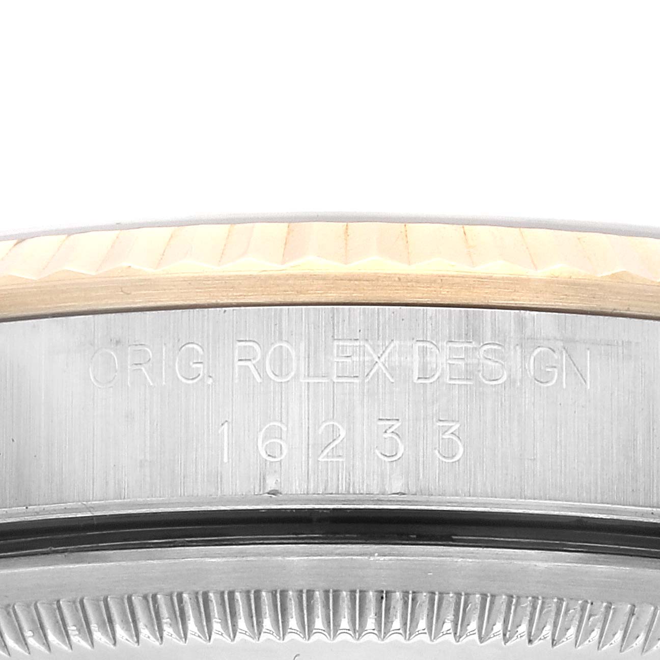 The image shows a close-up of the model number and the fluted bezel of a Rolex Datejust 16233 Men's Steel and Gold (two tone) Black Dial 16233 Men's Steel and Gold (two tone) Black Dial watch.