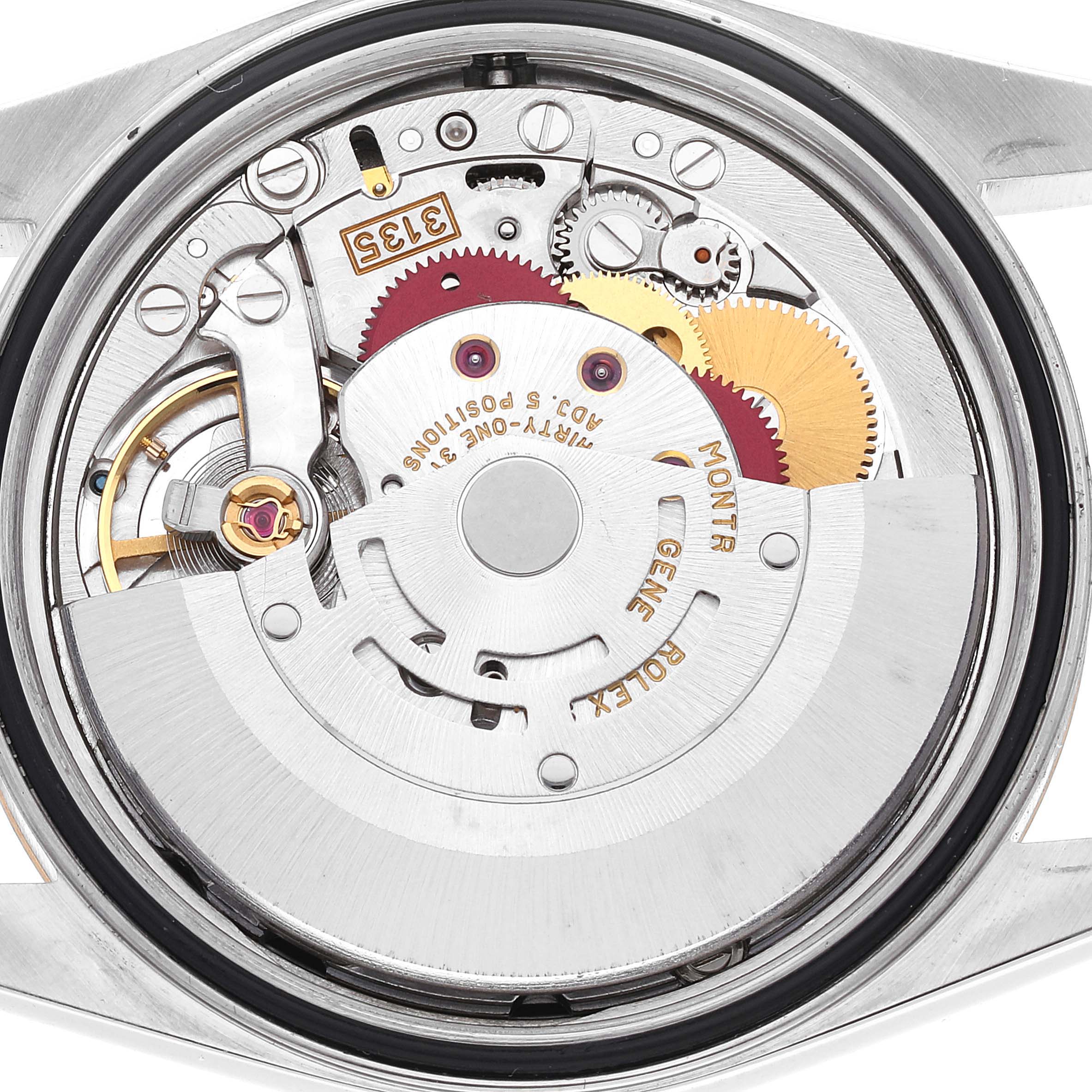 This image shows the internal mechanism and movement of a Rolex Datejust 16233 Men's Steel and Gold (two tone) Black Dial 16233 Men's Steel and Gold (two tone) Black Dial watch from a top-down view.