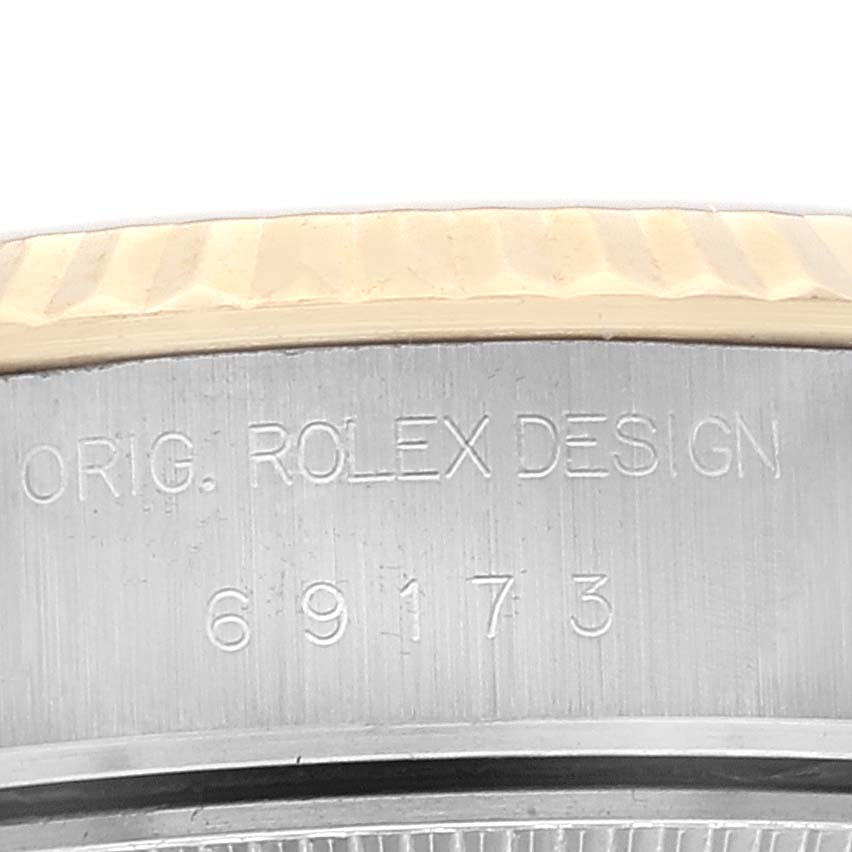 This image shows the serial number engraving on the side of the case of a Rolex Datejust 69173 Women's Steel and Gold (two tone) Champagne Dial 69173 Women's Steel and Gold (two tone) Champagne Dial watch.