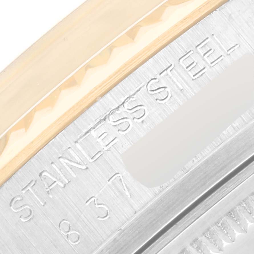 This close-up angle shows the side engraving and a part of the bezel of the Rolex Vintage Collection 16013 Men's Steel and Gold (two tone) Champagne Dial 16013 Men's Steel and Gold (two tone) Champagne Dial watch.