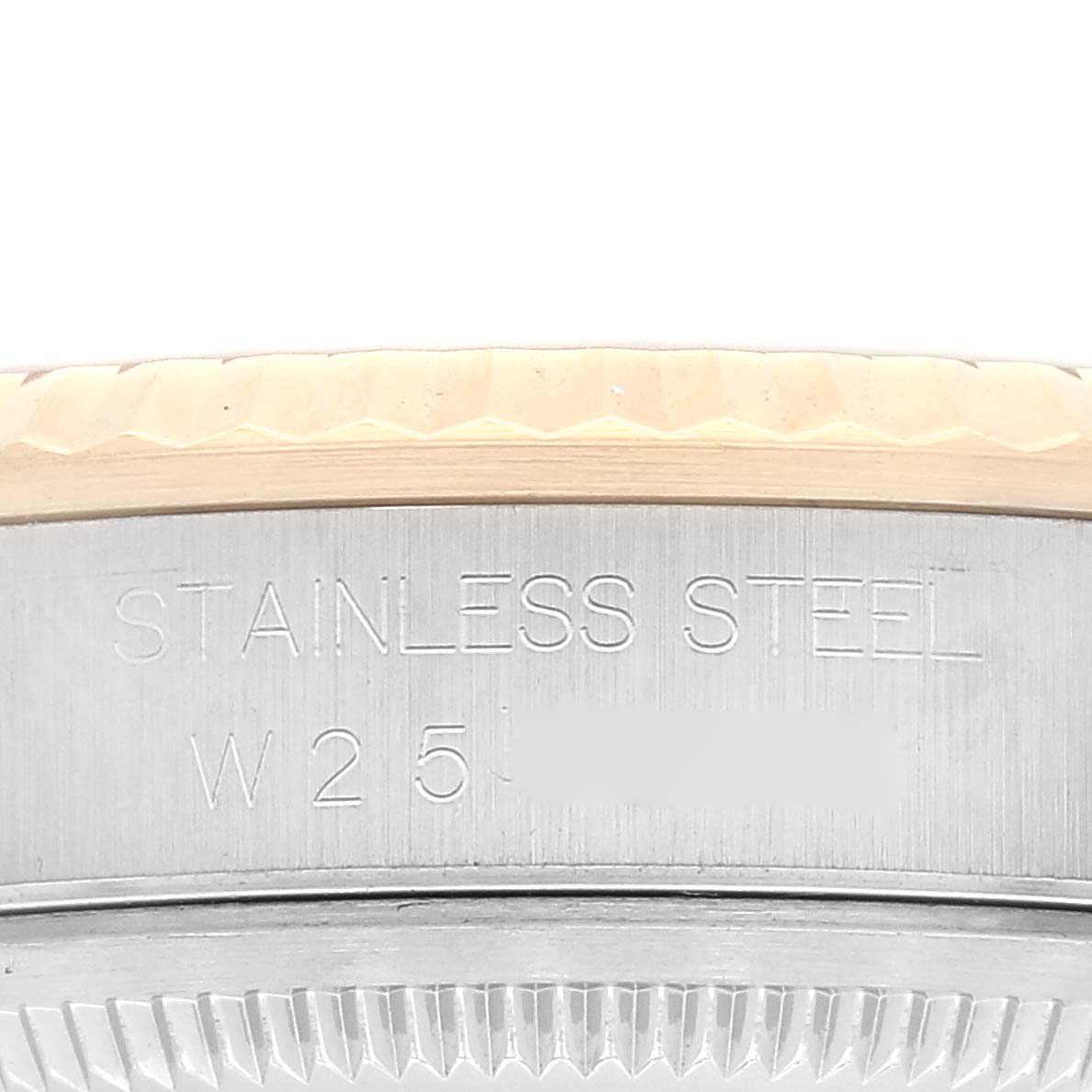 This image shows a close-up of the side of a Rolex Datejust 16233 Men's Steel and Gold (two tone) White Dial 16233 Men's Steel and Gold (two tone) White Dial watch case, highlighting the bezel and stainless steel marking.