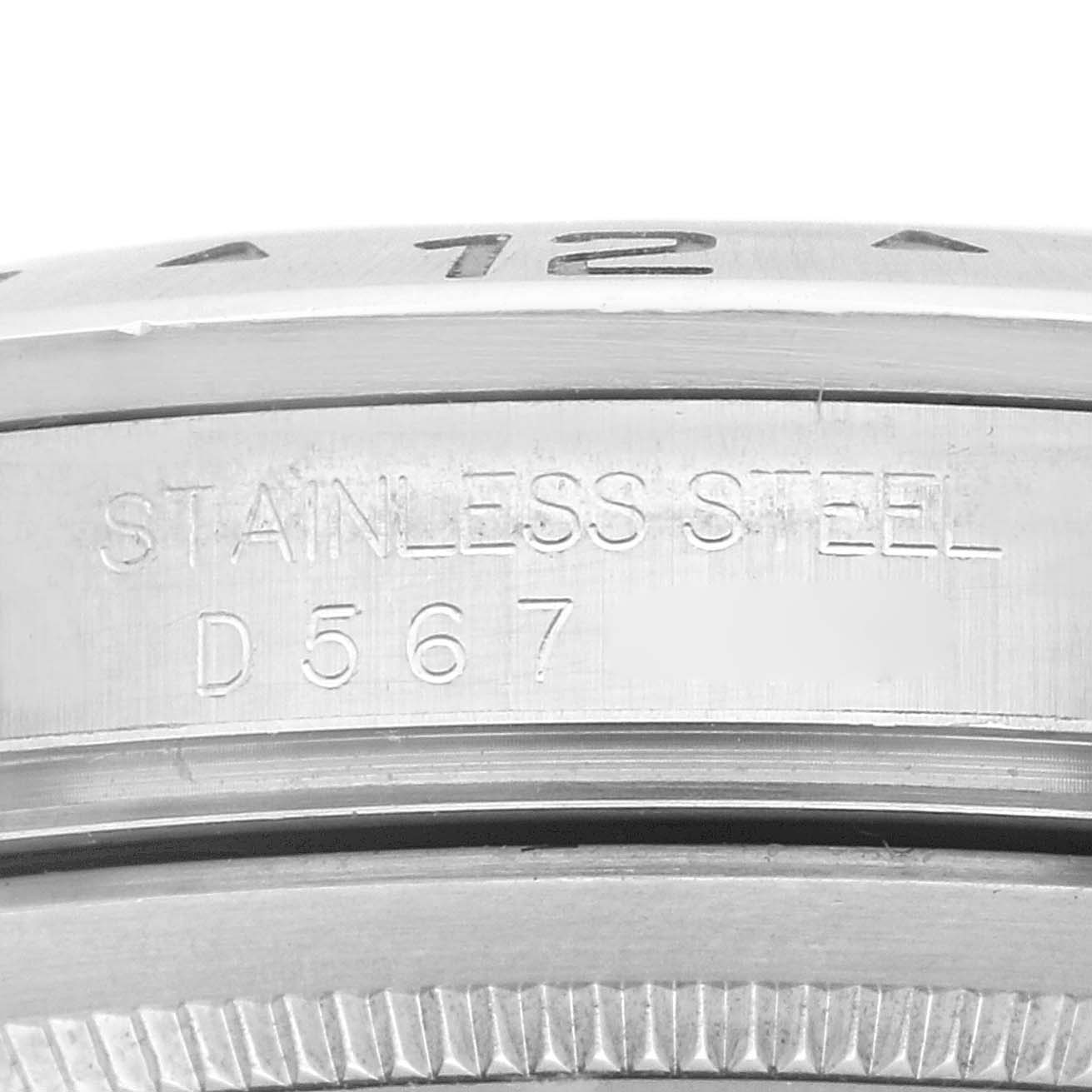 The image shows a close-up of the stainless steel bezel and serial number on a Rolex Explorer 16570 Men
s Stainless Steel White Dial 16570 Men
s Stainless Steel White Dial watch.