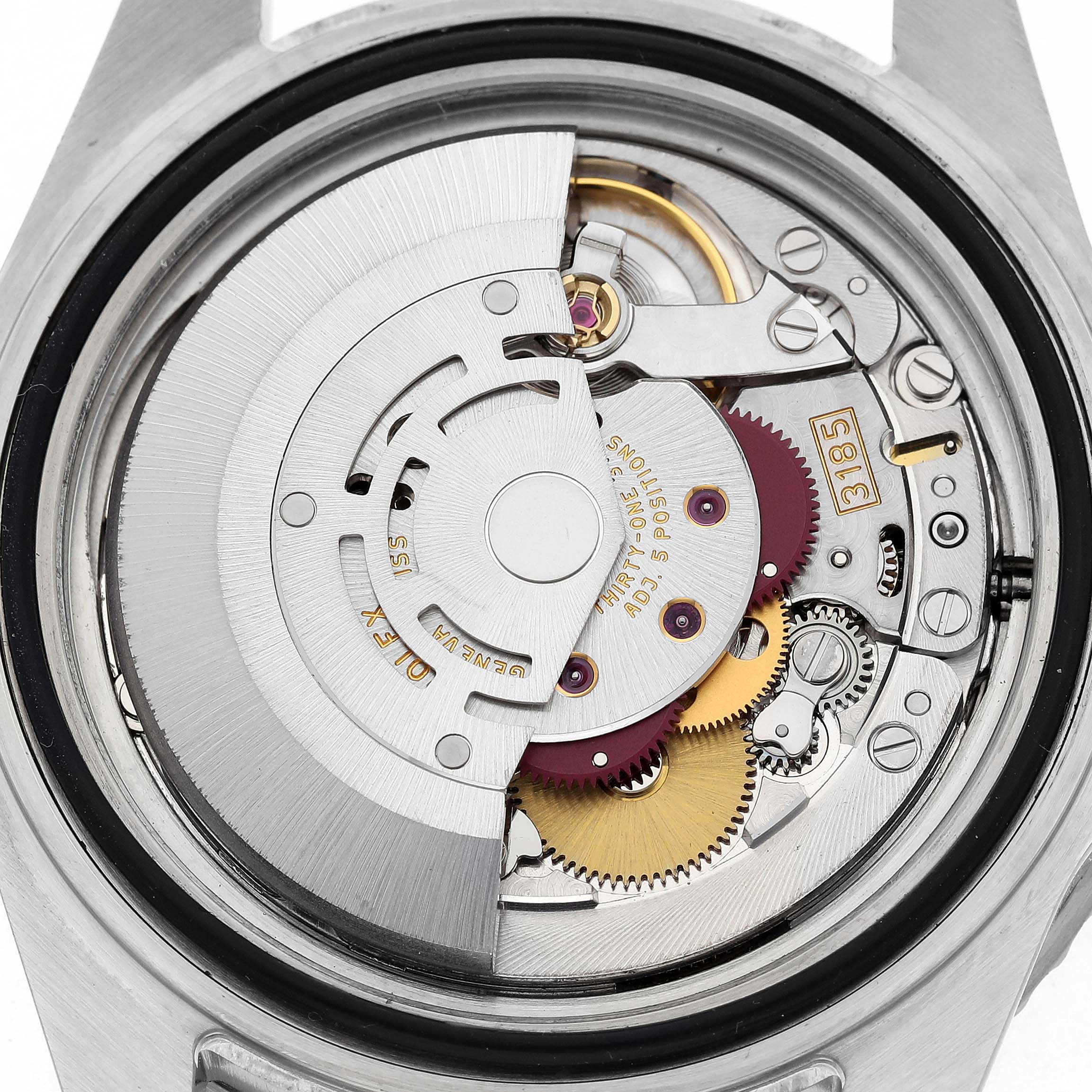 The image shows the back view of a Rolex GMT-Master 16710 Men's Stainless Steel Black Dial, revealing its intricate movement and gears.