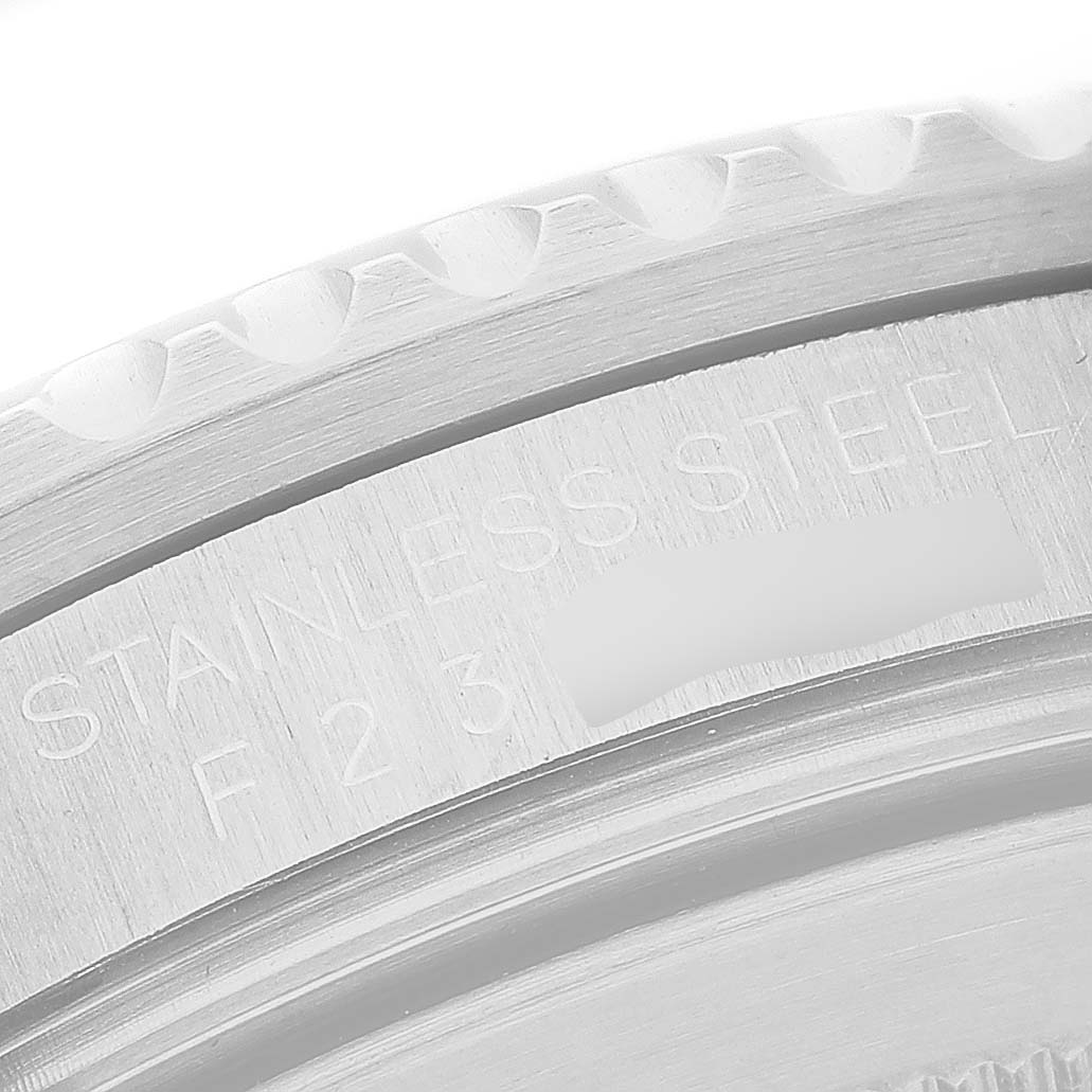 The image displays the side view of a Rolex GMT-Master 16710 Men's Stainless Steel Black Dial watch, focusing on the bezel and part of the case with "STAINLESS STEEL" engraved.