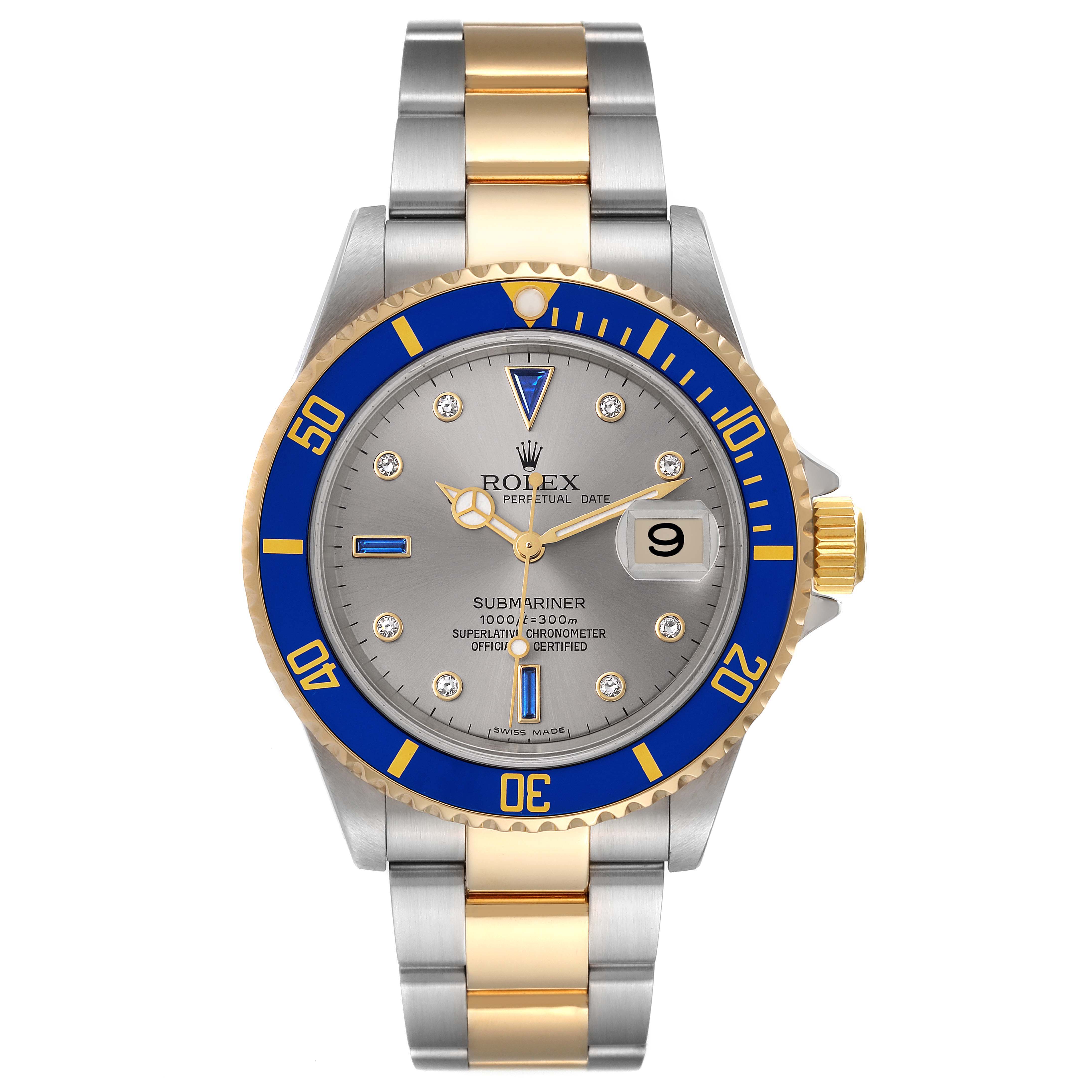 The image shows a front view of a Rolex Submariner 16613T Men's Steel and Gold (two tone) Grey Dial 16613T Men's Steel and Gold (two tone) Grey Dial watch with a blue and gold bezel, grey dial, and two-tone bracelet.