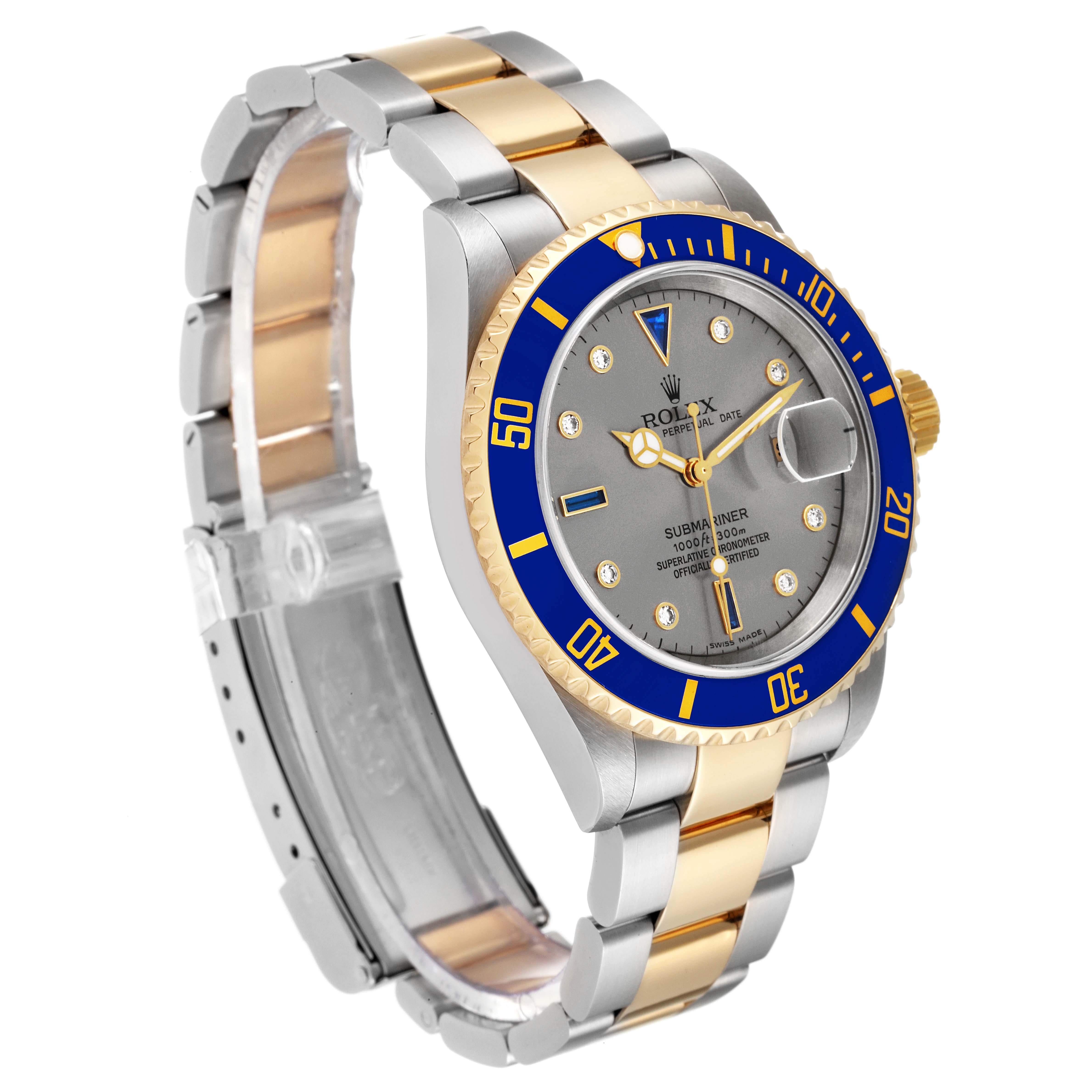This Rolex Submariner 16613T Men's Steel and Gold (two tone) Grey Dial 16613T Men's Steel and Gold (two tone) Grey Dial watch is shown at an angled view, highlighting its bracelet, bezel, dial, and crown.
