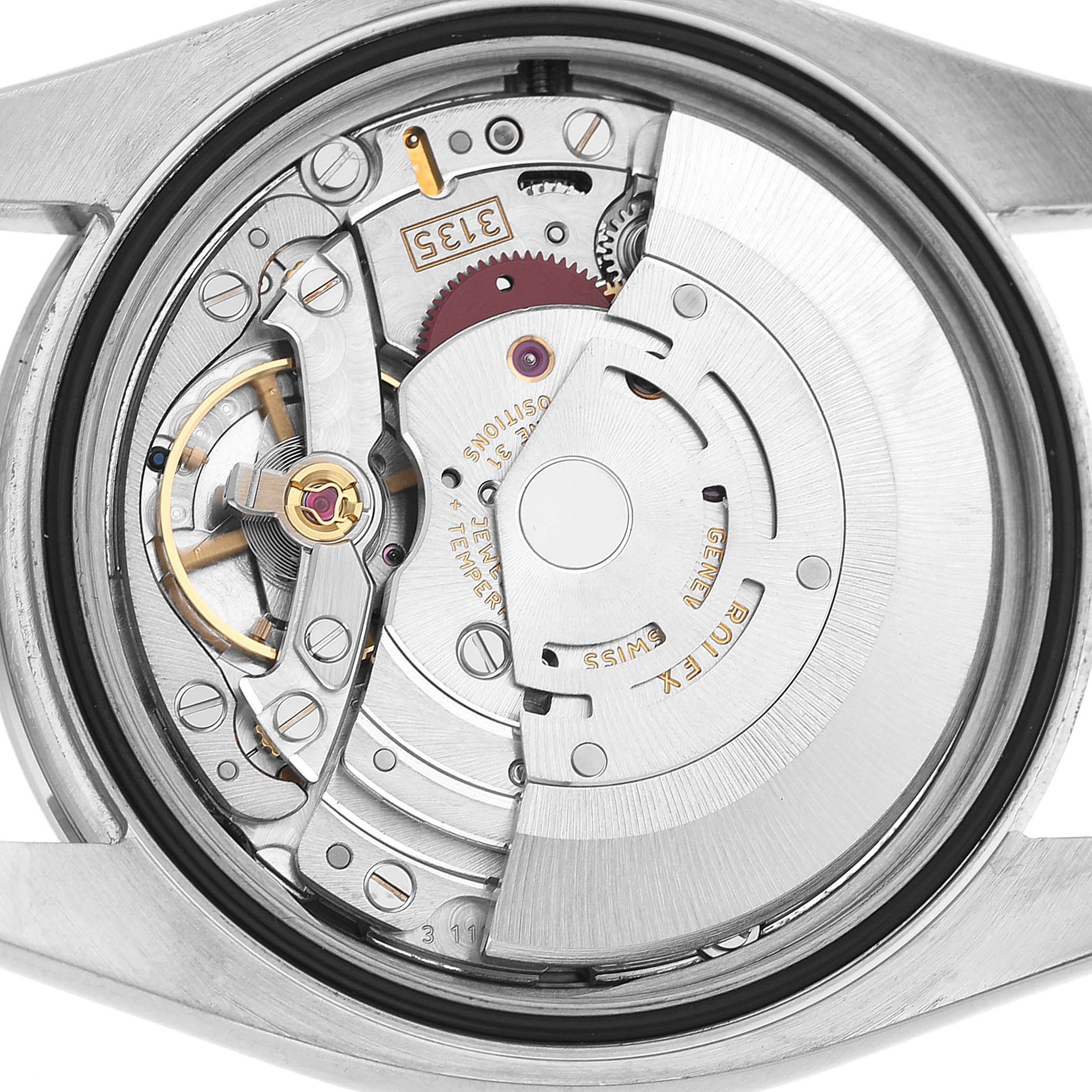The image shows the internal mechanism of a Rolex Turn-o-Graph 116264 Men's Stainless Steel Yellow Dial watch viewed from the back, highlighting the rotor and movement components.
