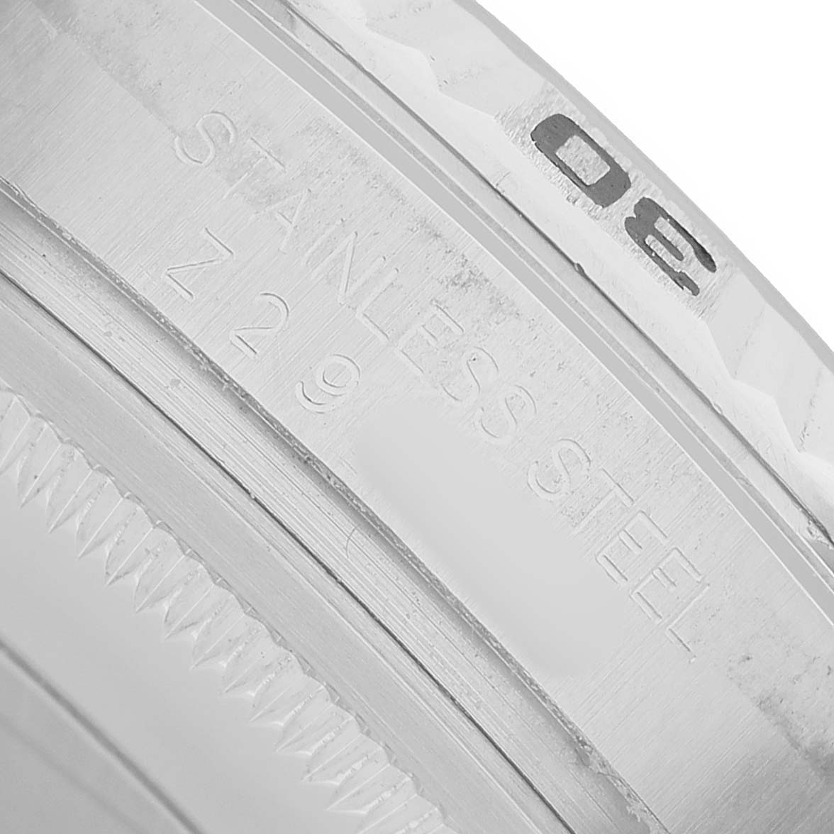 The image shows a close-up of the bezel and engraving on the Rolex Turn-o-Graph 116264 Men's Stainless Steel Black Dial's stainless steel casing.