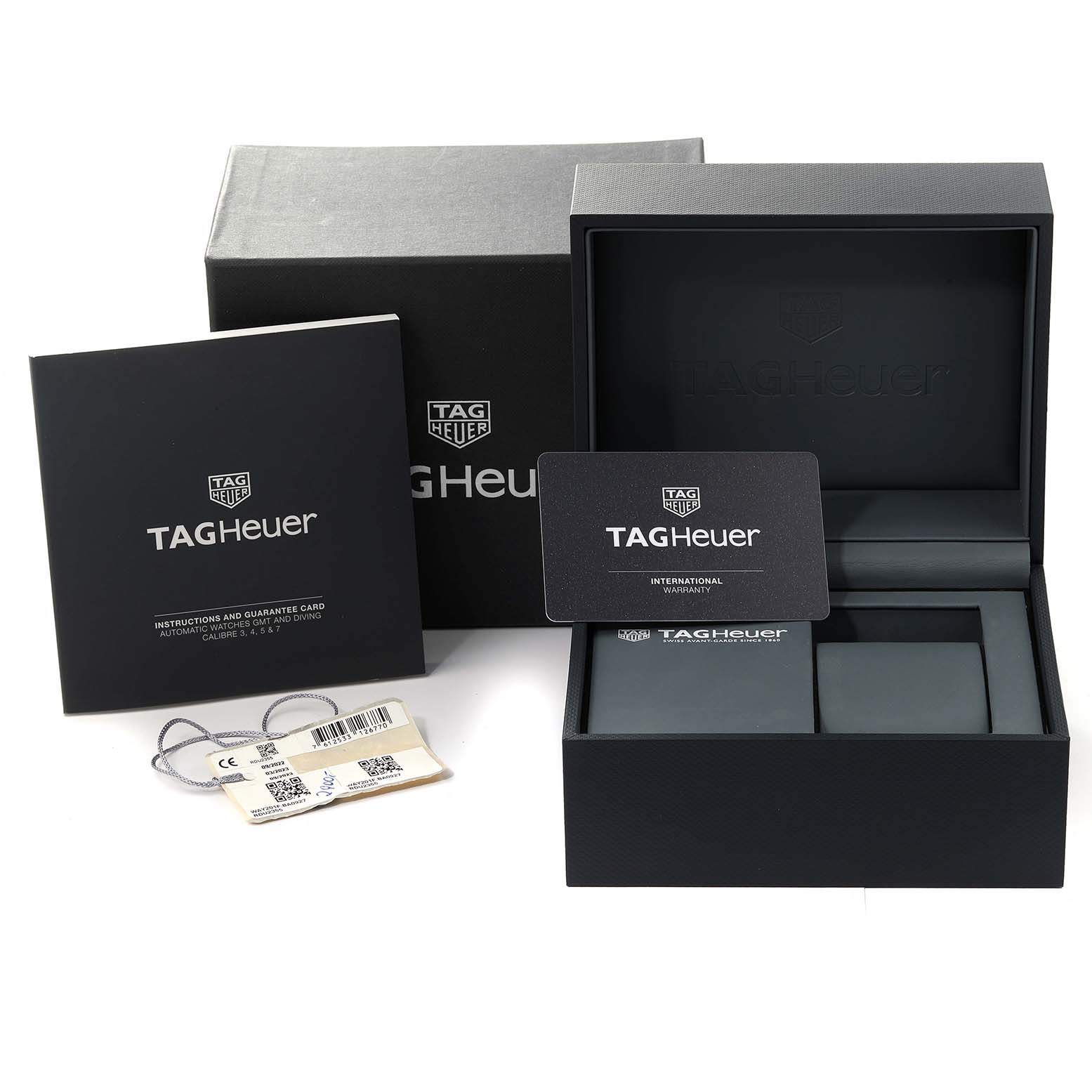 The image shows the packaging, warranty card, instruction manual, and tag for the Tag Heuer Aquaracer WAY201F.BA0927 Men's Stainless Steel Black Dial WAY201F.BA0927 Men's Stainless Steel Black Dial model.