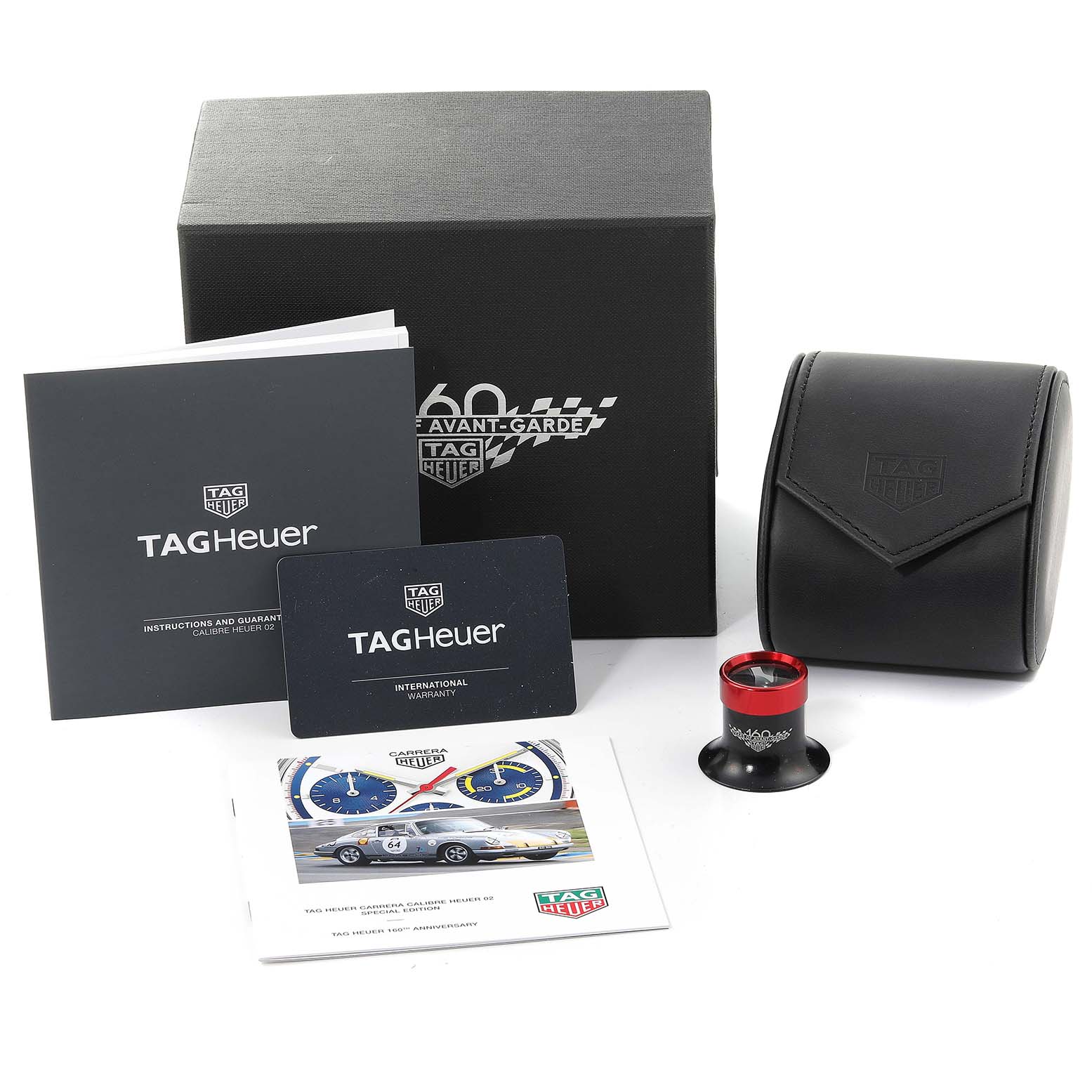 The image shows the Tag Heuer Carrera CBK221C.FC6488 Men's Stainless Steel White Dial CBK221C.FC6488 Men's Stainless Steel White Dial watch packaging, including the box, manuals, warranty card, watch case, and a loupe.