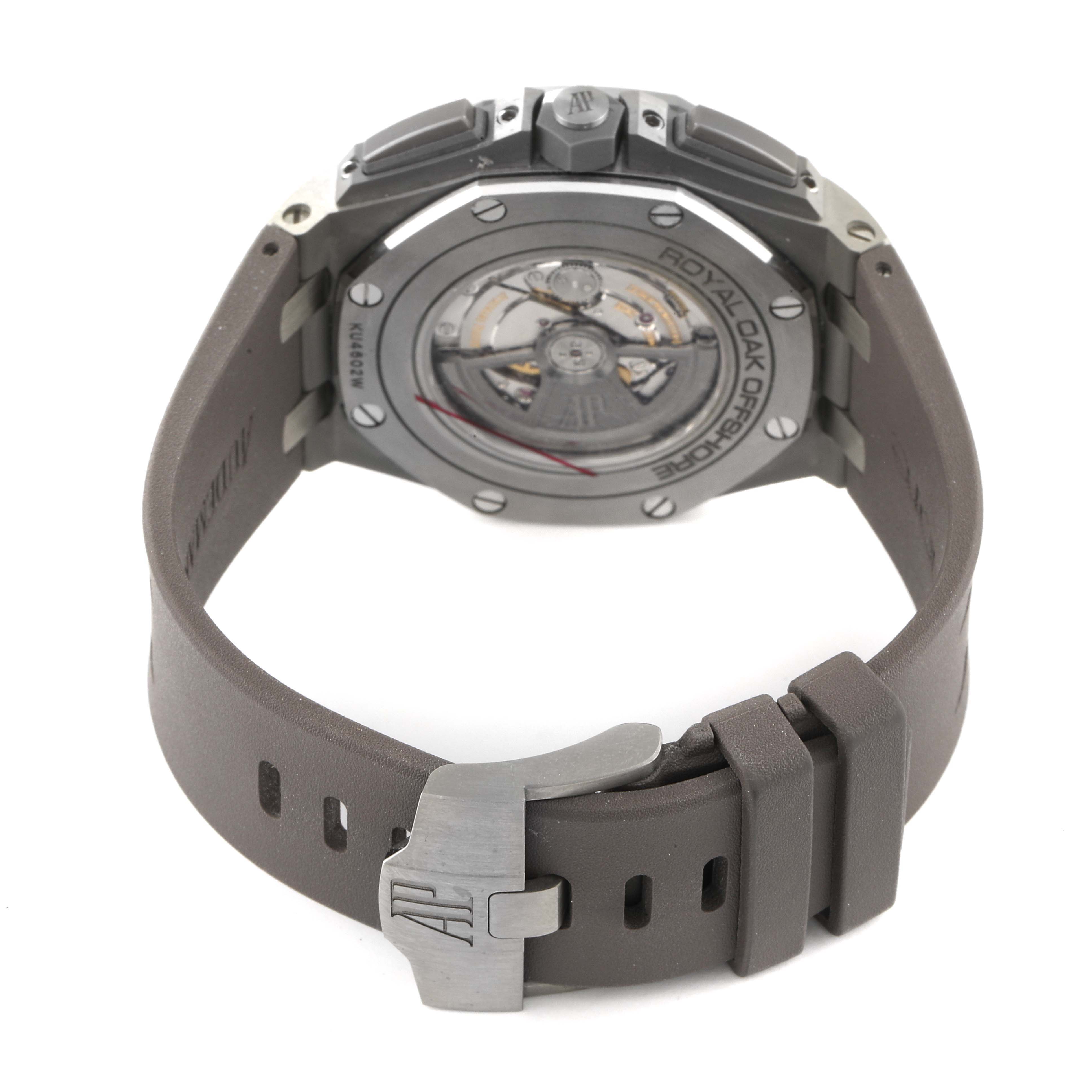 The image shows the back view of an Audemars Piguet Royal Oak Offshore 26400IO.OO.A004CA.02 Men's Titanium Grey Dial 26400IO.OO.A004CA.02 Men's Titanium Grey Dial watch, highlighting the case back, strap, and buckle.