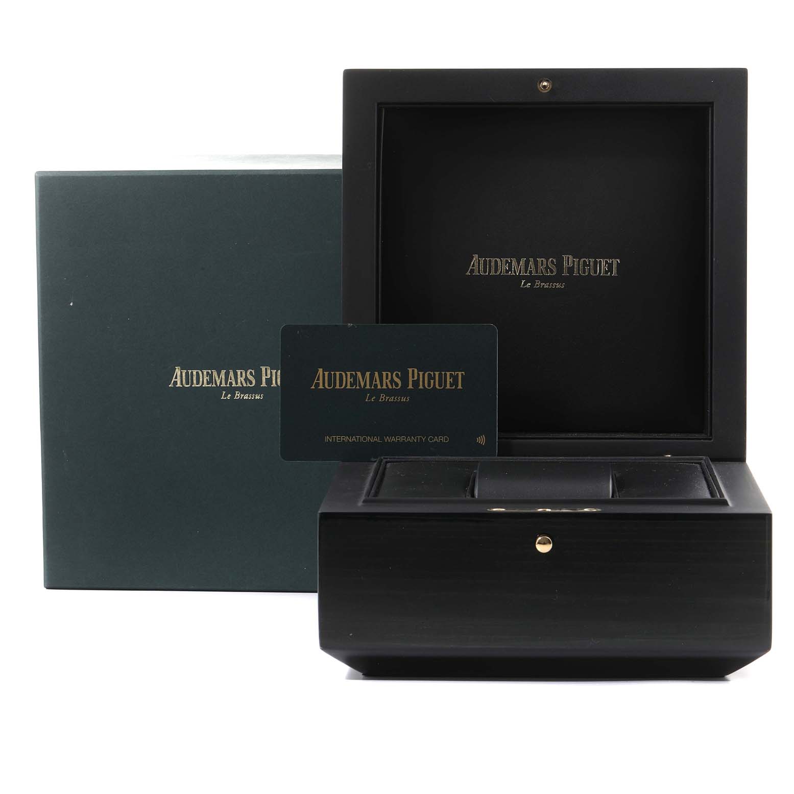 The image shows the packaging, presentation box, and international warranty card for a Royal Oak Offshore model by Audemars Piguet.