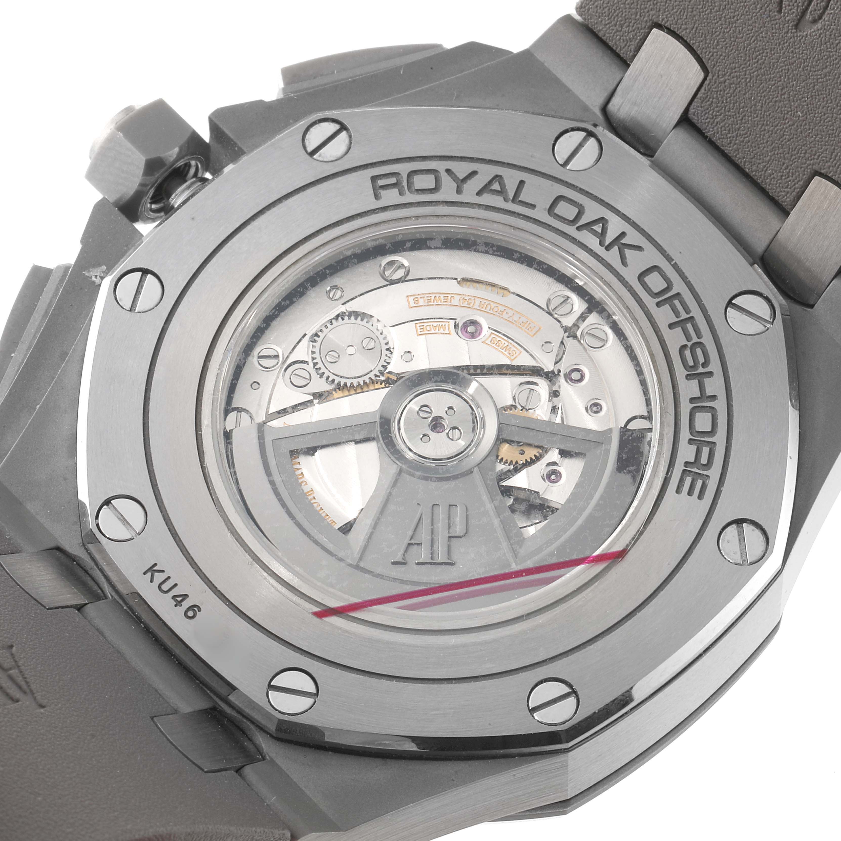 The image shows the back of a Royal Oak Offshore by Audemars Piguet, revealing the watch movement and rotor.