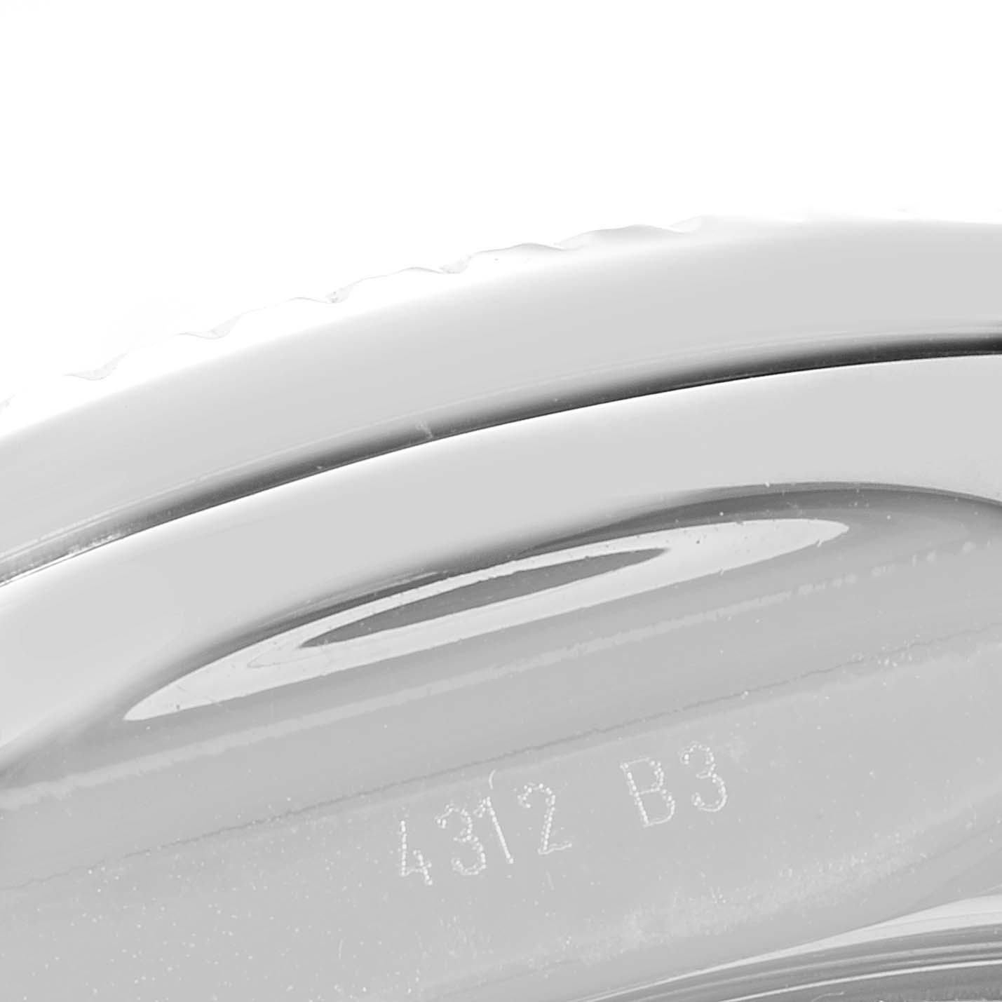 The image shows a close-up of the edge and bezel of a Breitling Bentley A41390 Men's Stainless Steel Black Dial A41390 Men's Stainless Steel Black Dial watch, including some engraved numbers.