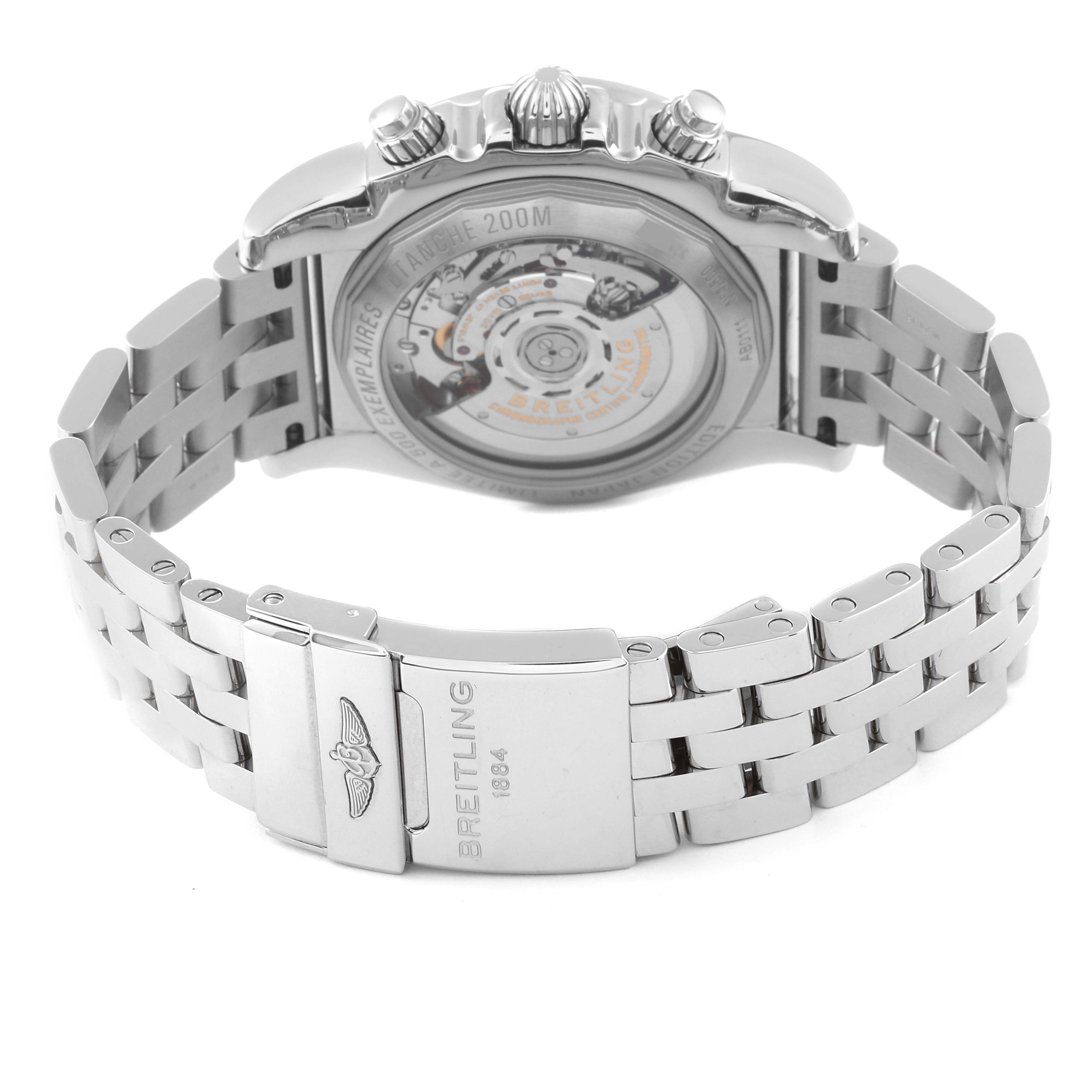 The image shows the back and metallic bracelet of a Breitling Limited Series watch, highlighting the clasp and mechanical movement.