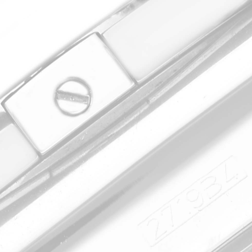 This image shows a close-up shot of the side of the Limited Series Breitling watch, focusing on a screw and part of the serial number "27934."