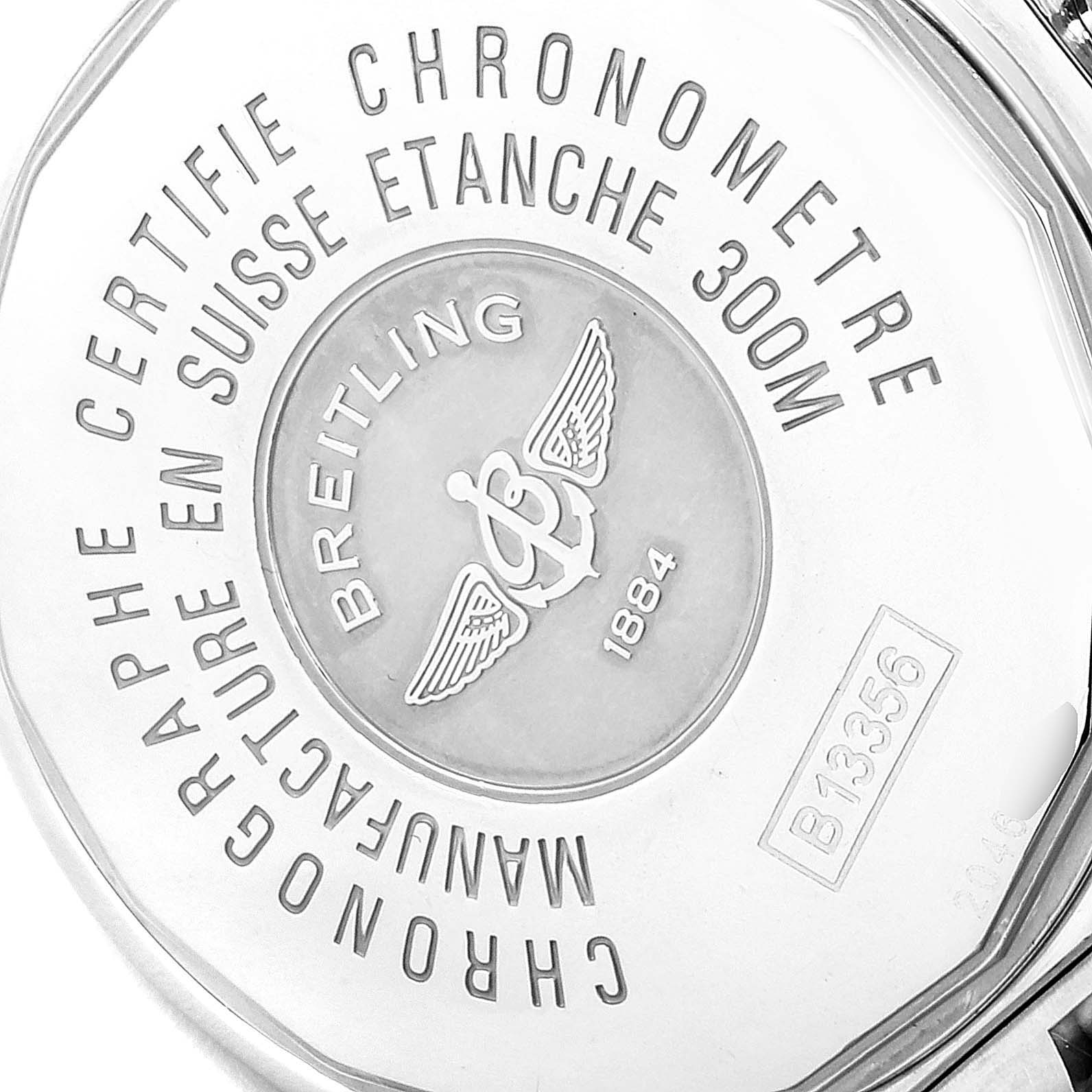 This image shows the engraved case back of a Breitling Chronomat B13356 Men's Steel and Gold (two tone) Blue Dial B13356 Men's Steel and Gold (two tone) Blue Dial watch, highlighting its branding and certification.