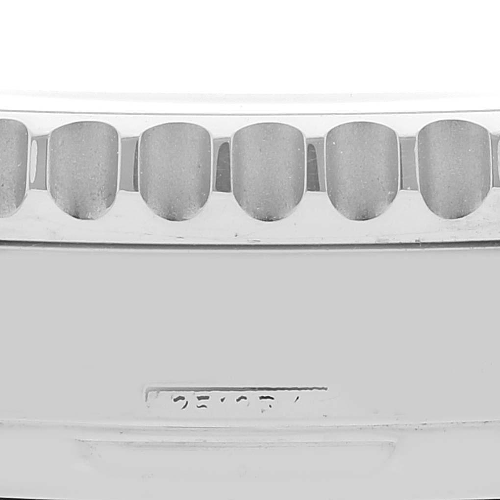 This close-up image shows the bezel of a Breitling Navitimer AB0123 Men's Stainless Steel Silver Dial AB0123 Men's Stainless Steel Silver Dial watch.