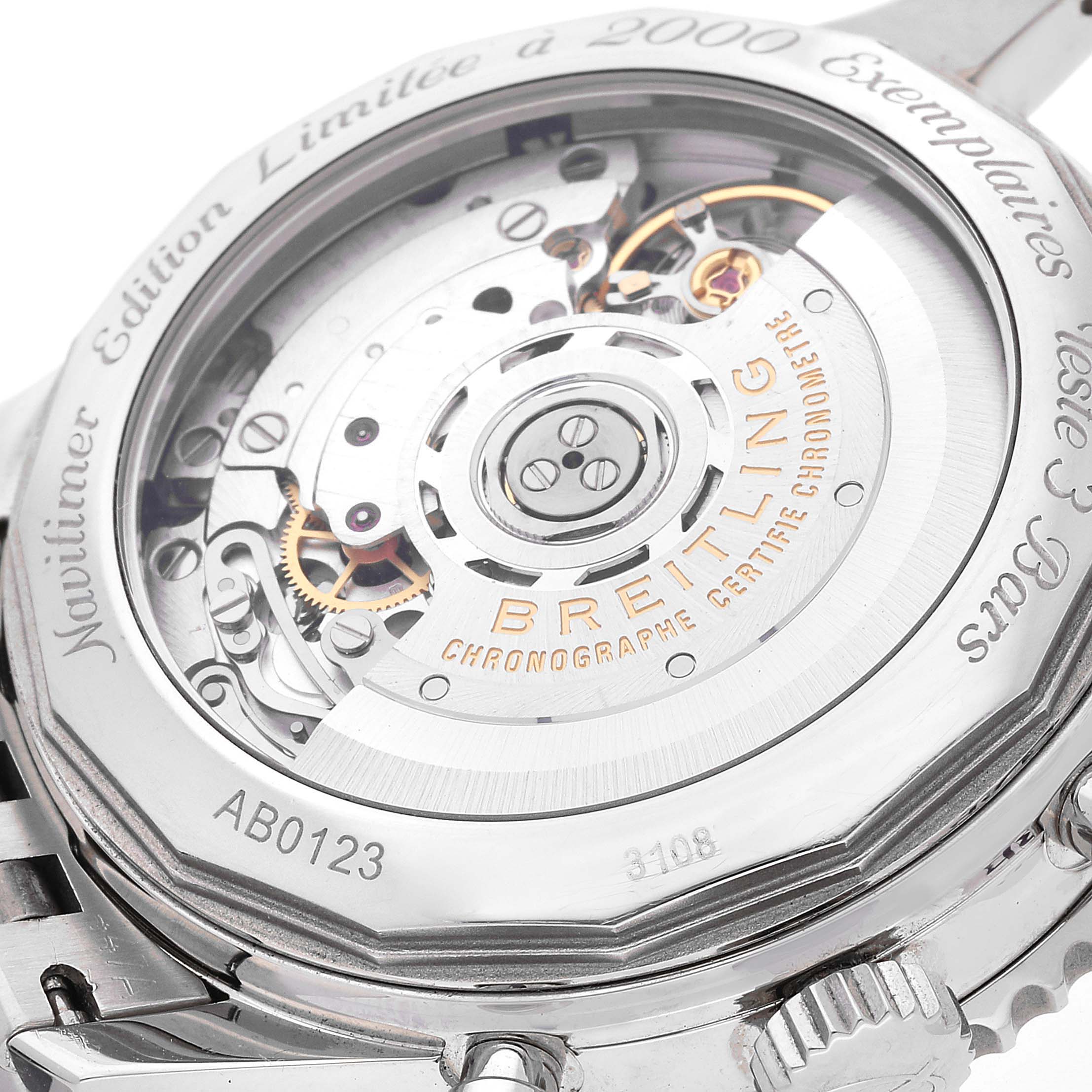The image shows the back of a Breitling Navitimer AB0123 Men's Stainless Steel Silver Dial AB0123 Men's Stainless Steel Silver Dial watch, revealing its intricate mechanical movement and engraved details.