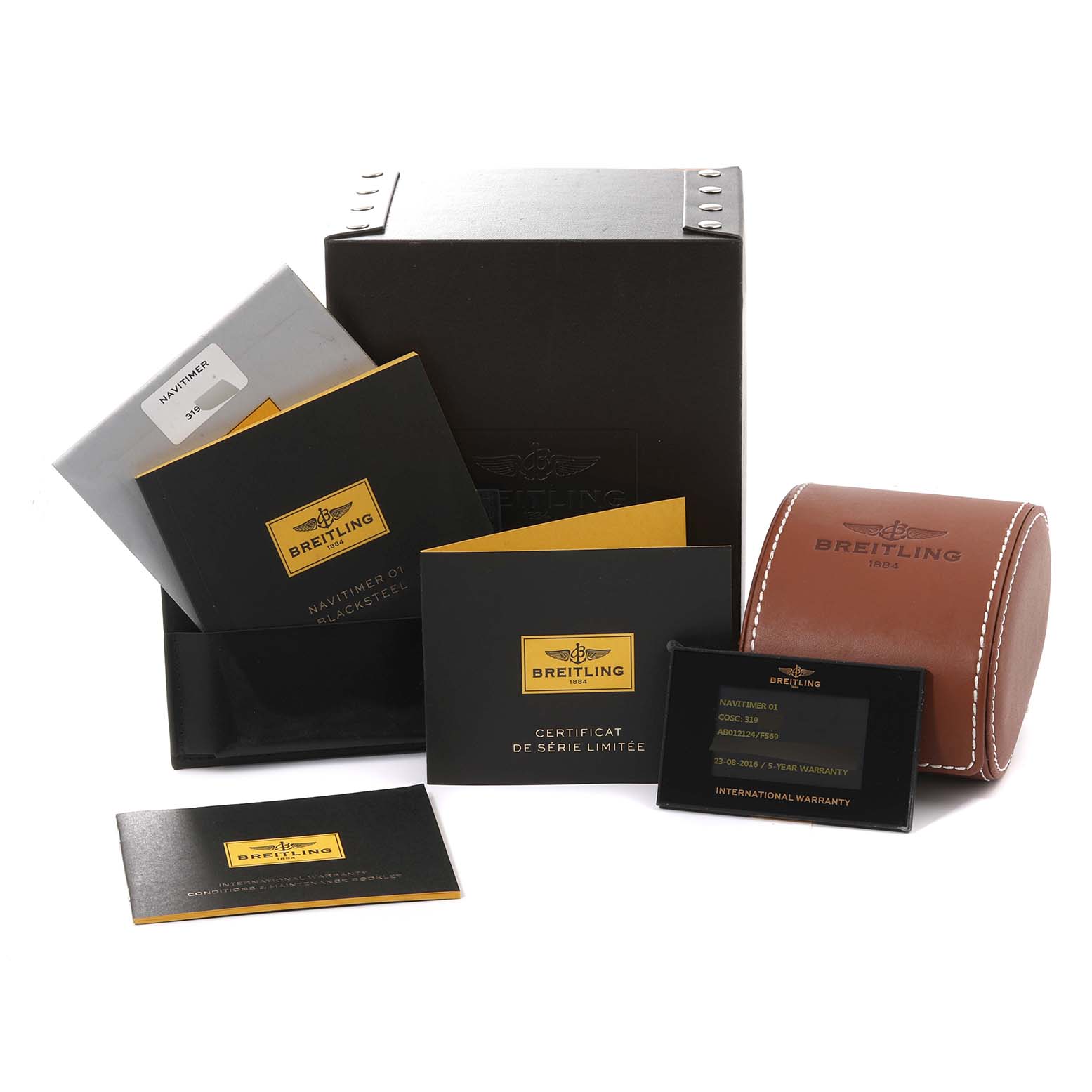 This image shows the packaging, booklet, certificate, and warranty card for a Breitling Limited Series model.