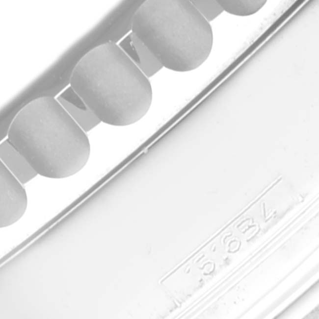 The image shows part of the bracelet and a serial number on a Limited Series Breitling watch.