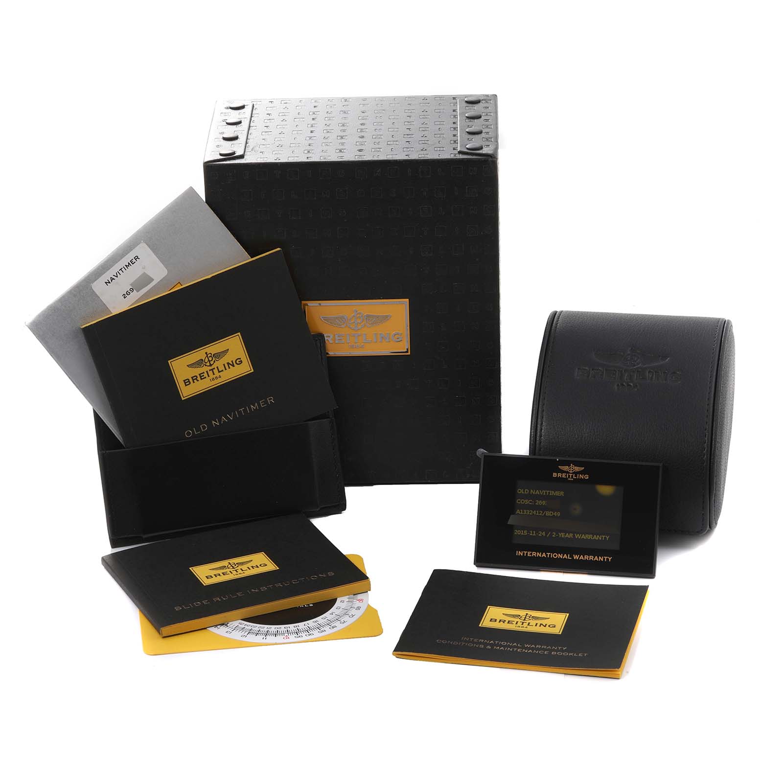 The image shows the box, warranty card, booklet, and leather case for the Breitling Navitimer A1332412/BD49 Men
s Stainless Steel Black Dial A1332412/BD49 Men
s Stainless Steel Black Dial watch model.