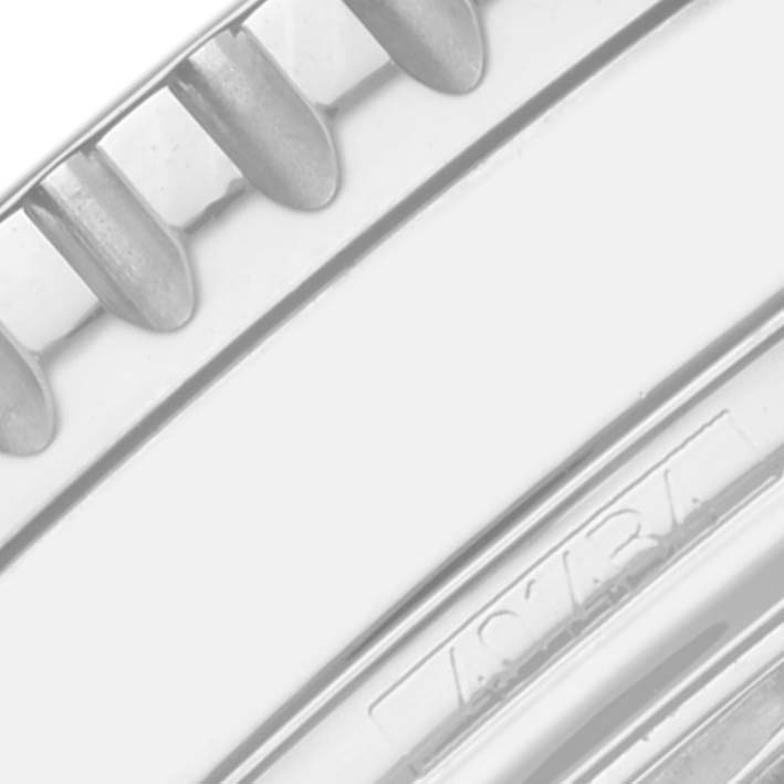 The image shows a close-up of the bezel and part of the case of a Breitling Navitimer A1332412/BD49 Men
s Stainless Steel Black Dial A1332412/BD49 Men
s Stainless Steel Black Dial watch.