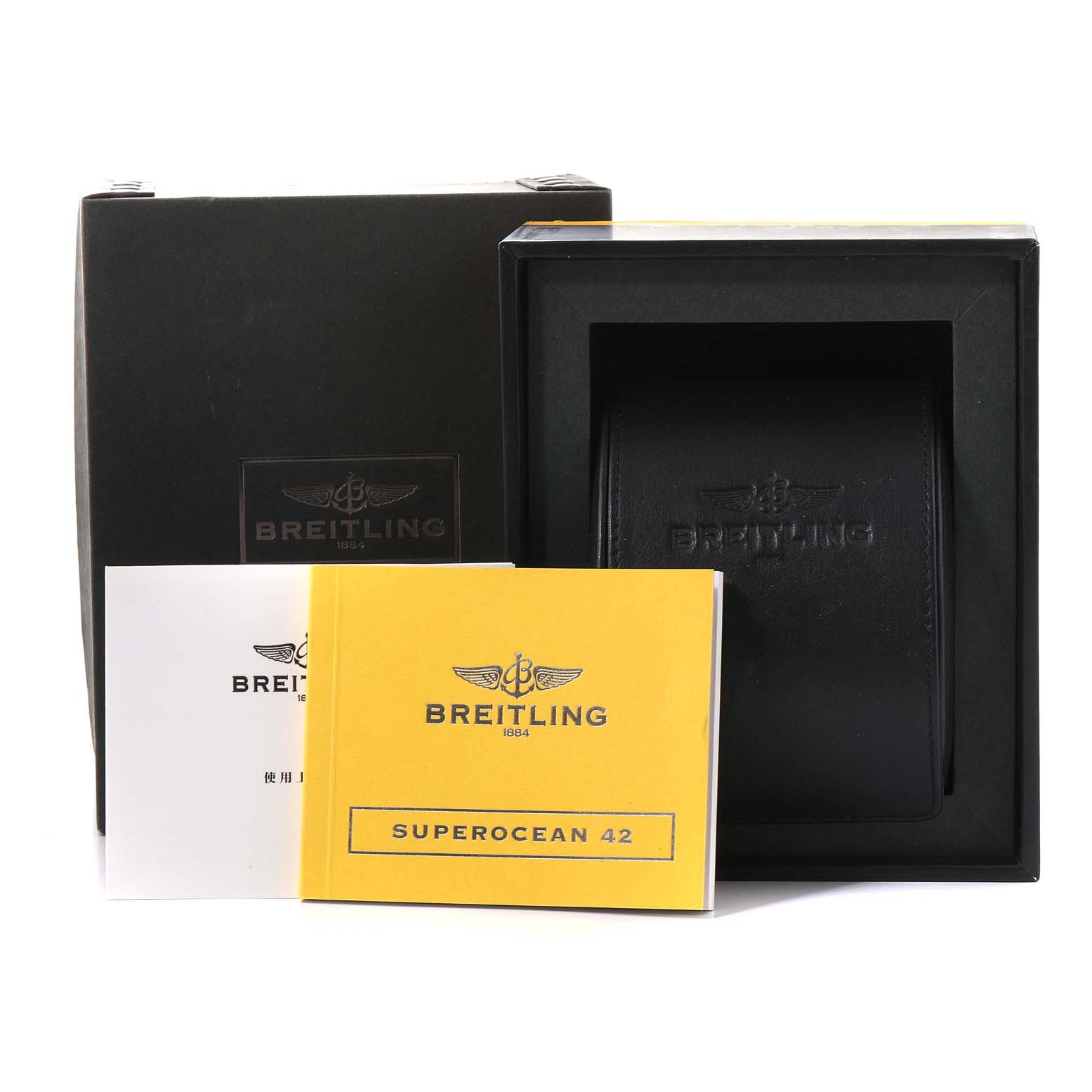 This image shows the packaging, manual, and carrying case for a Breitling Superocean A17364 Men's Stainless Steel Black Dial A17364 Men's Stainless Steel Black Dial 42 watch.
