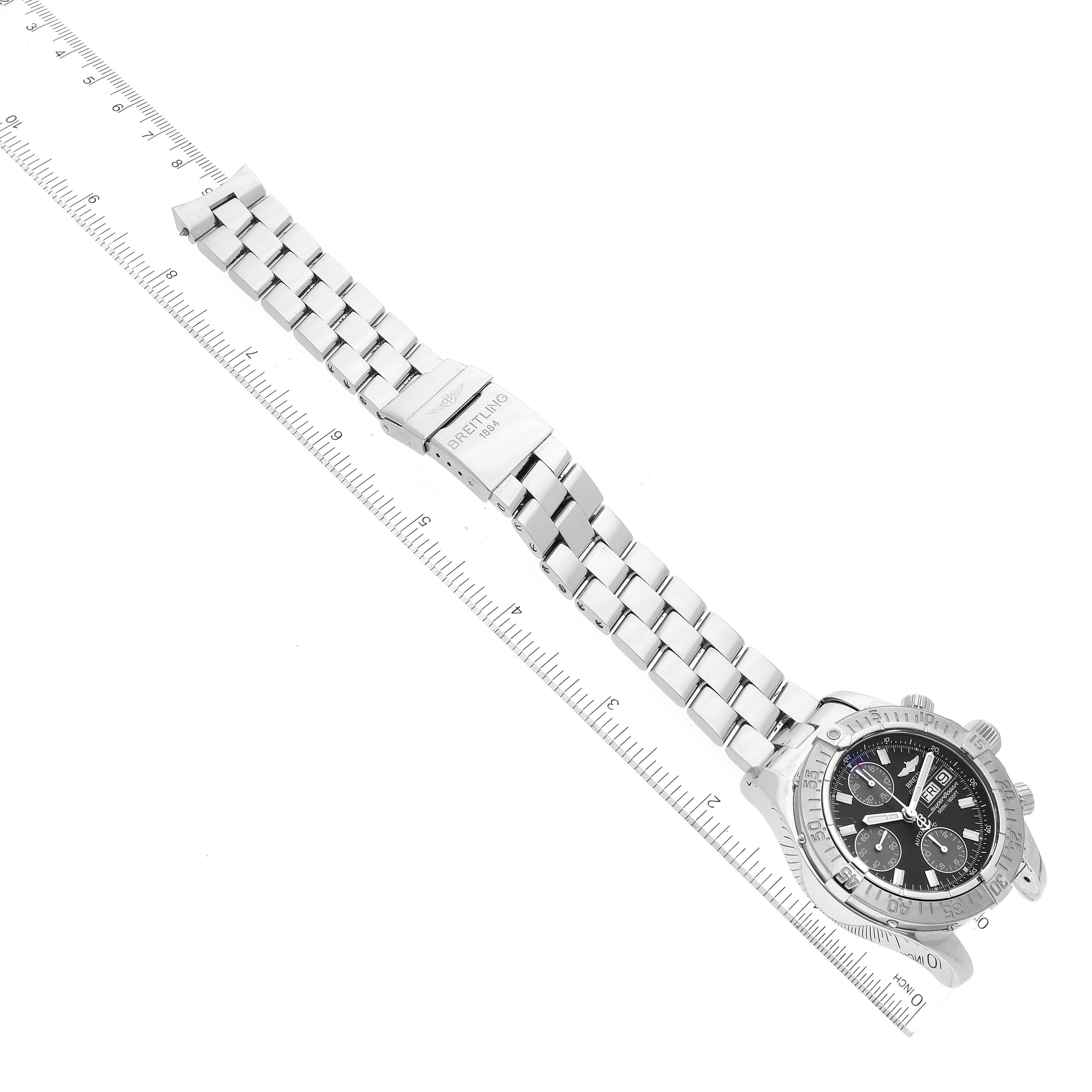 The image shows a Breitling Superocean A13340 Men's Stainless Steel Black Dial A13340 Men's Stainless Steel Black Dial watch laid flat with its metal bracelet extended and a ruler for scale.