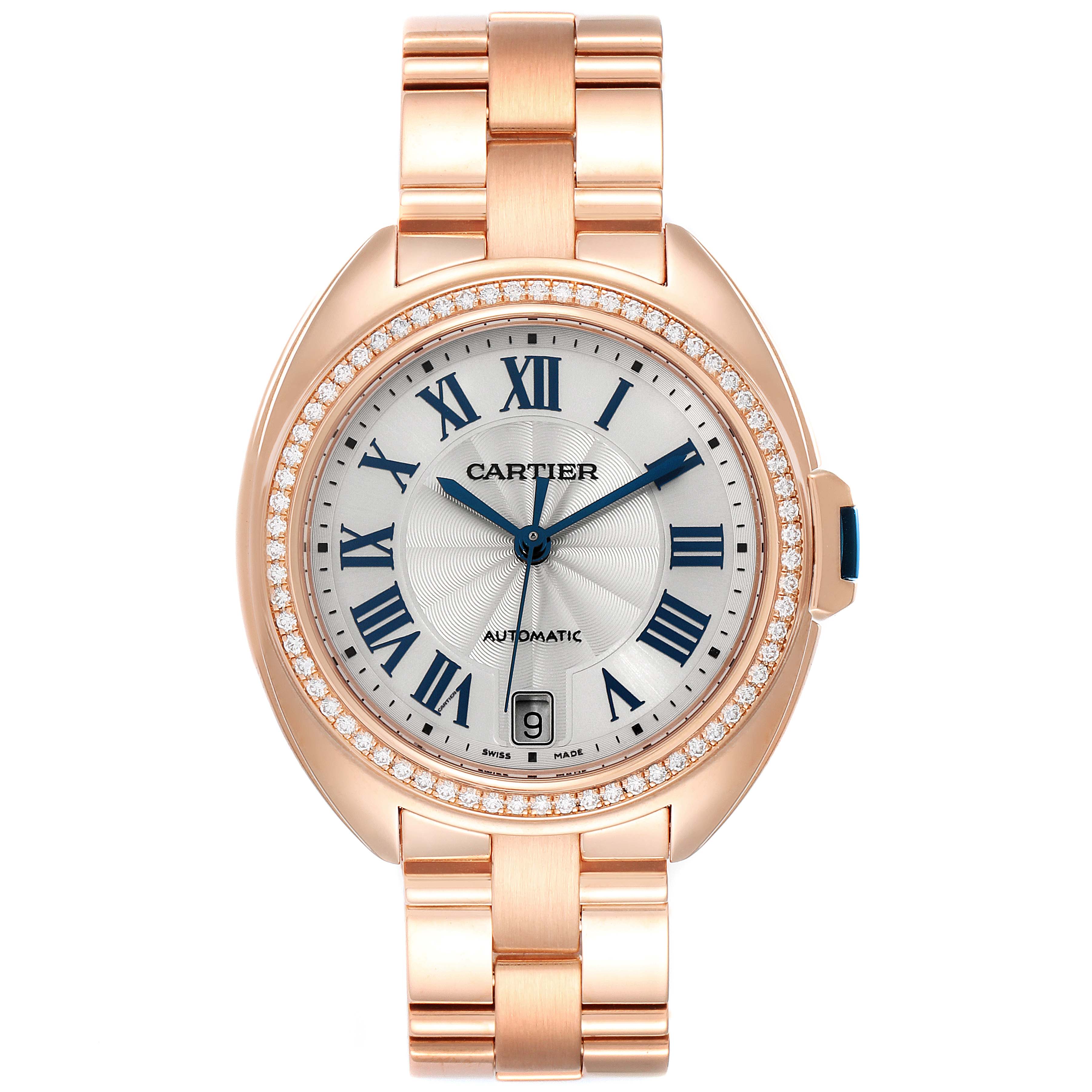 The image shows a close-up of the Cartier Clé model watch, featuring its face, bezel, and metal bracelet.