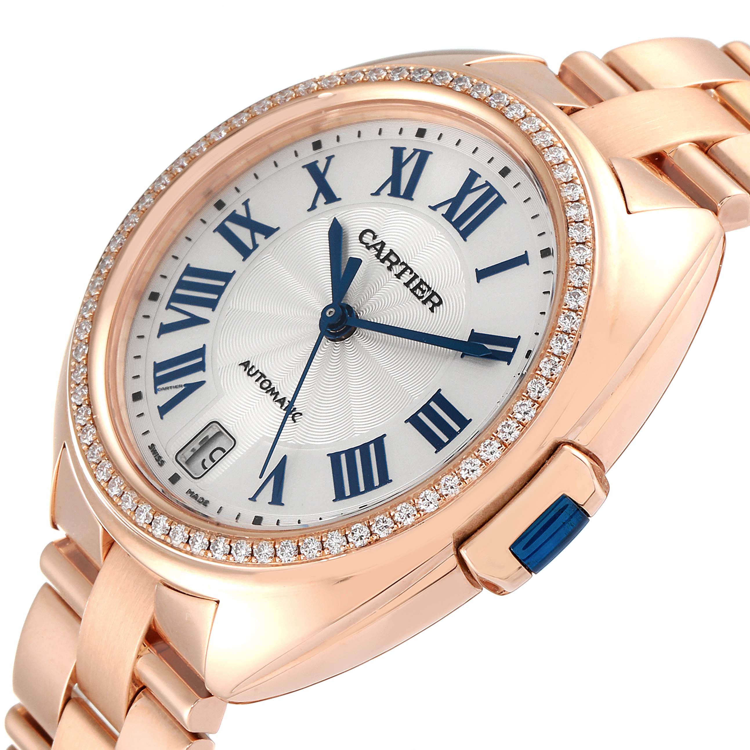 The image shows a close-up angle of the Cartier Cle WFCL0003 Women's Rose Gold Silver Dial WFCL0003 Women's Rose Gold Silver Dial model watch, highlighting the watch face, Roman numerals, date display, and diamond bezel.