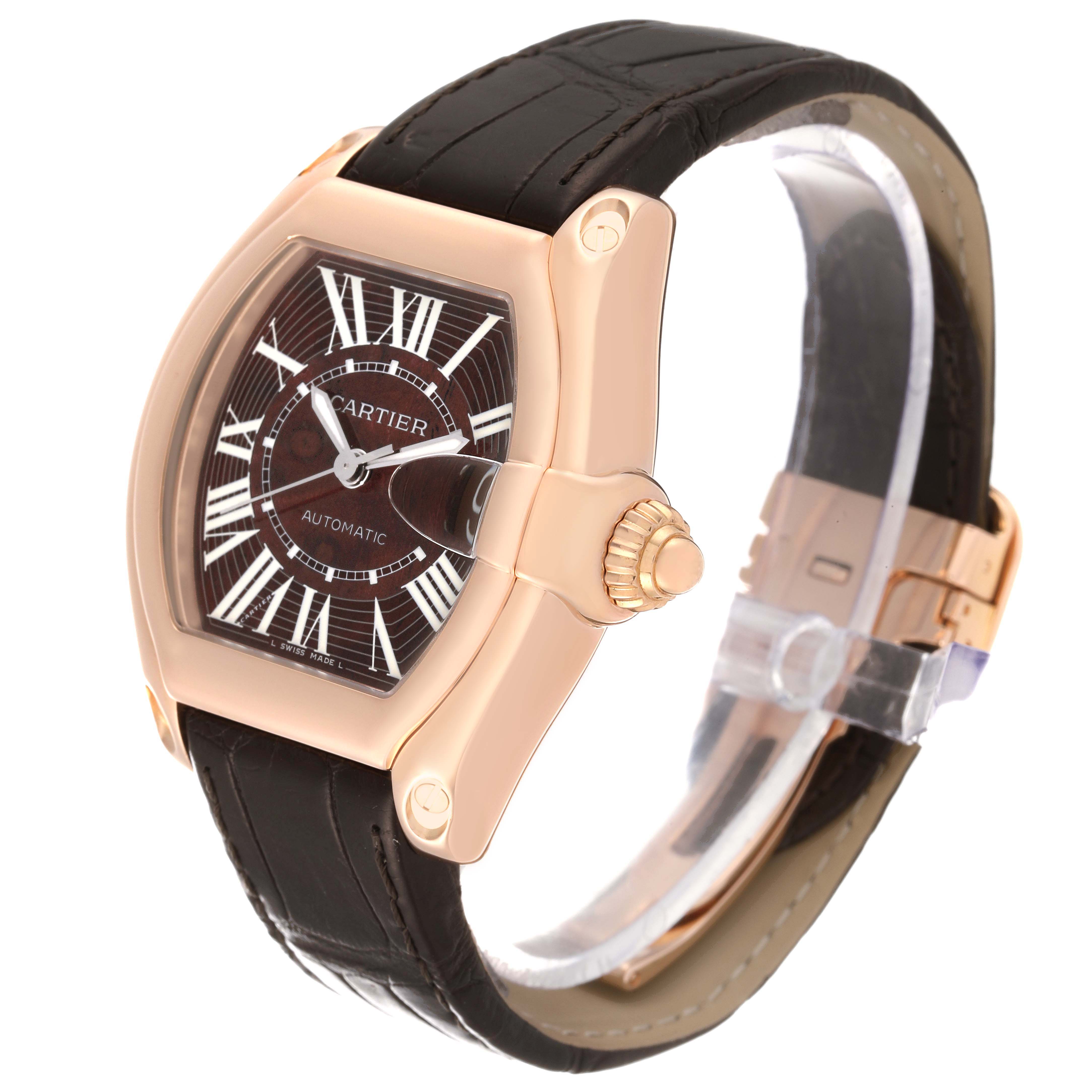 The Cartier Roadster W6206001 Men's Rose Gold Brown Dial W6206001 Men's Rose Gold Brown Dial watch is shown at an oblique angle, highlighting its face, crown, and leather strap.
