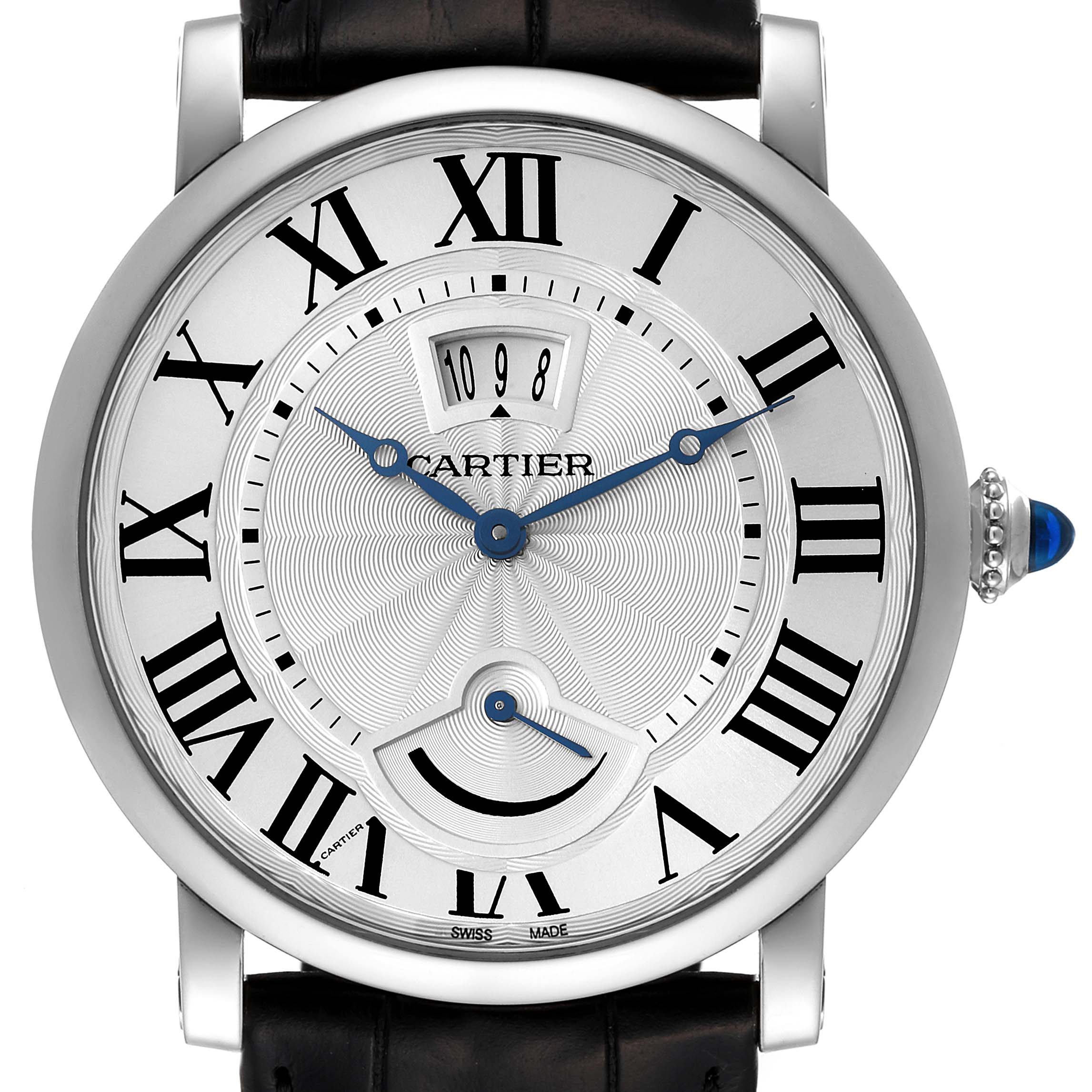 The image shows a frontal view of a Cartier Rotonde W1556369 Men's Stainless Steel Silver Dial W1556369 Men's Stainless Steel Silver Dial watch, highlighting the dial, Roman numerals, hands, date display, and crown with a blue cabochon.