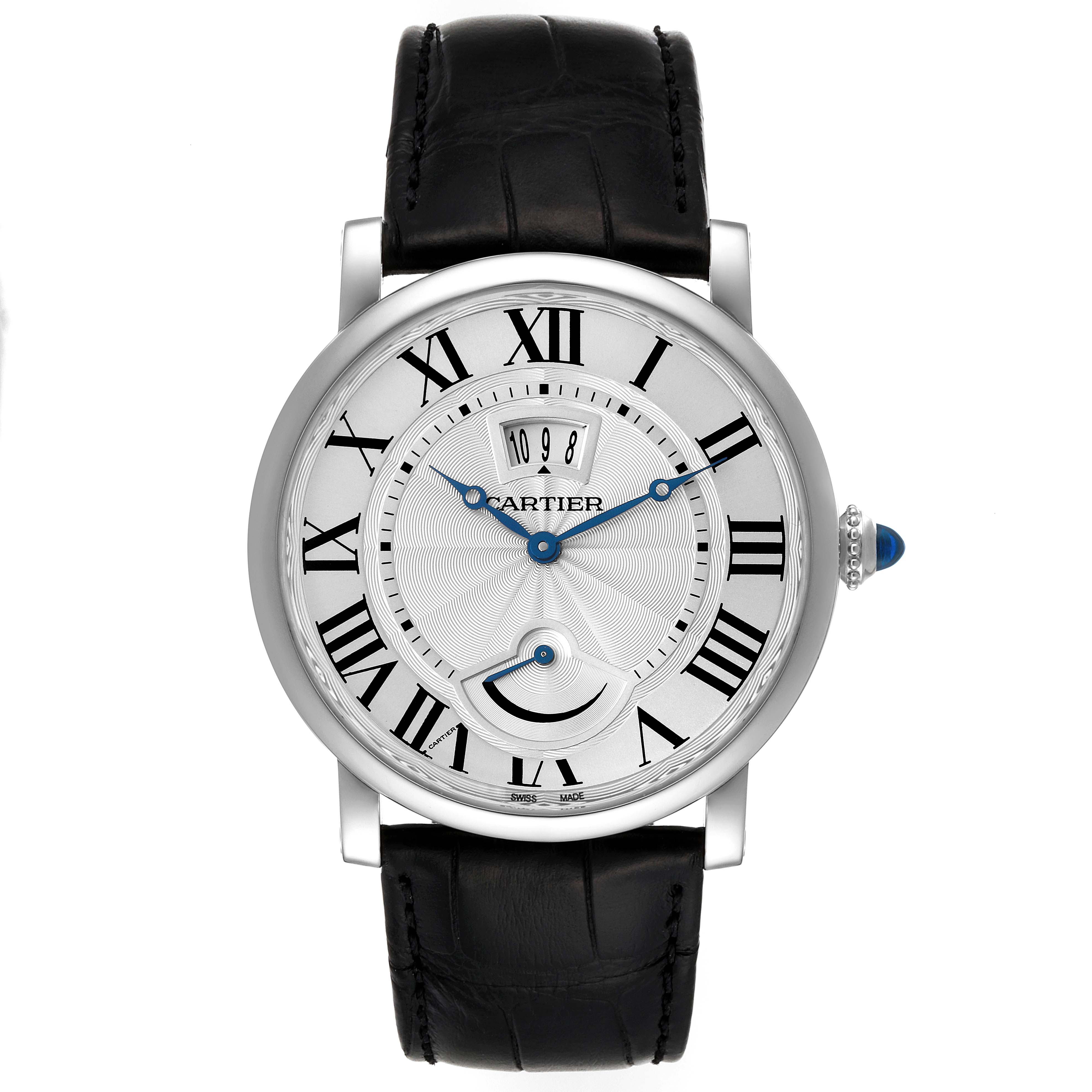 The image shows a front view of a Rotonde model by Cartier featuring a round dial, Roman numerals, blue hands, and a black leather strap.