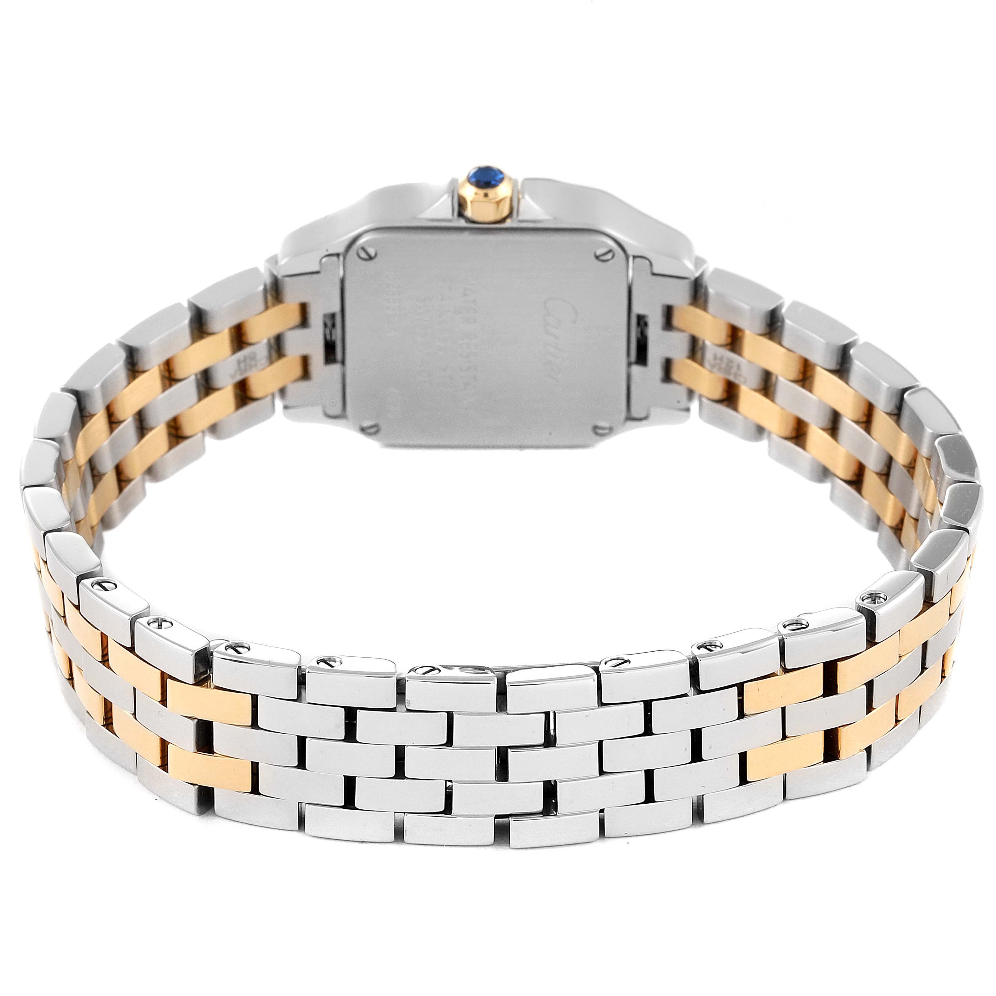 The image shows the back view of a Santos Demoiselle model by Cartier, highlighting its case back, crown, and two-tone bracelet.