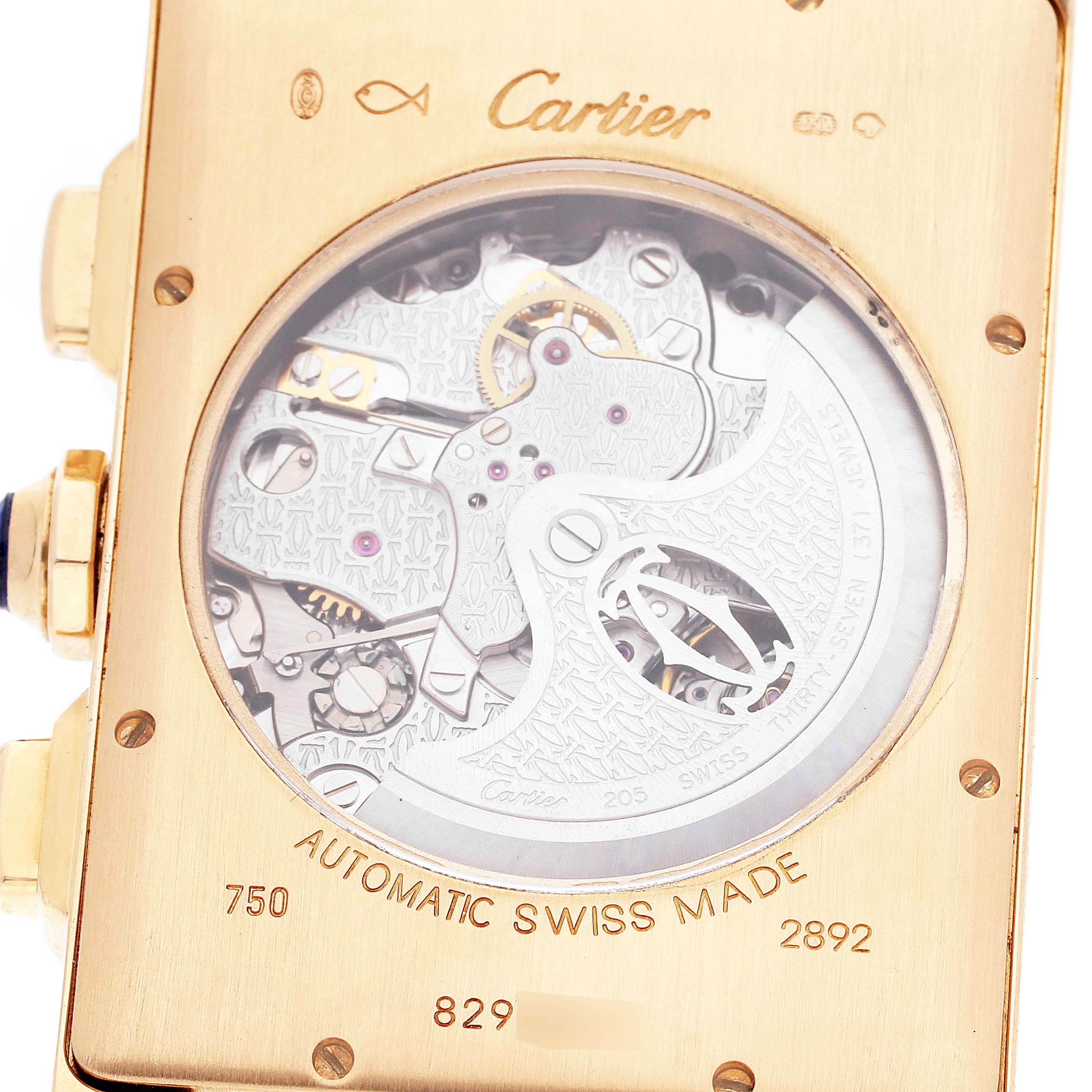 The image shows the back view of a Cartier Tank Américaine watch, displaying its automatic movement and intricate internal mechanisms.