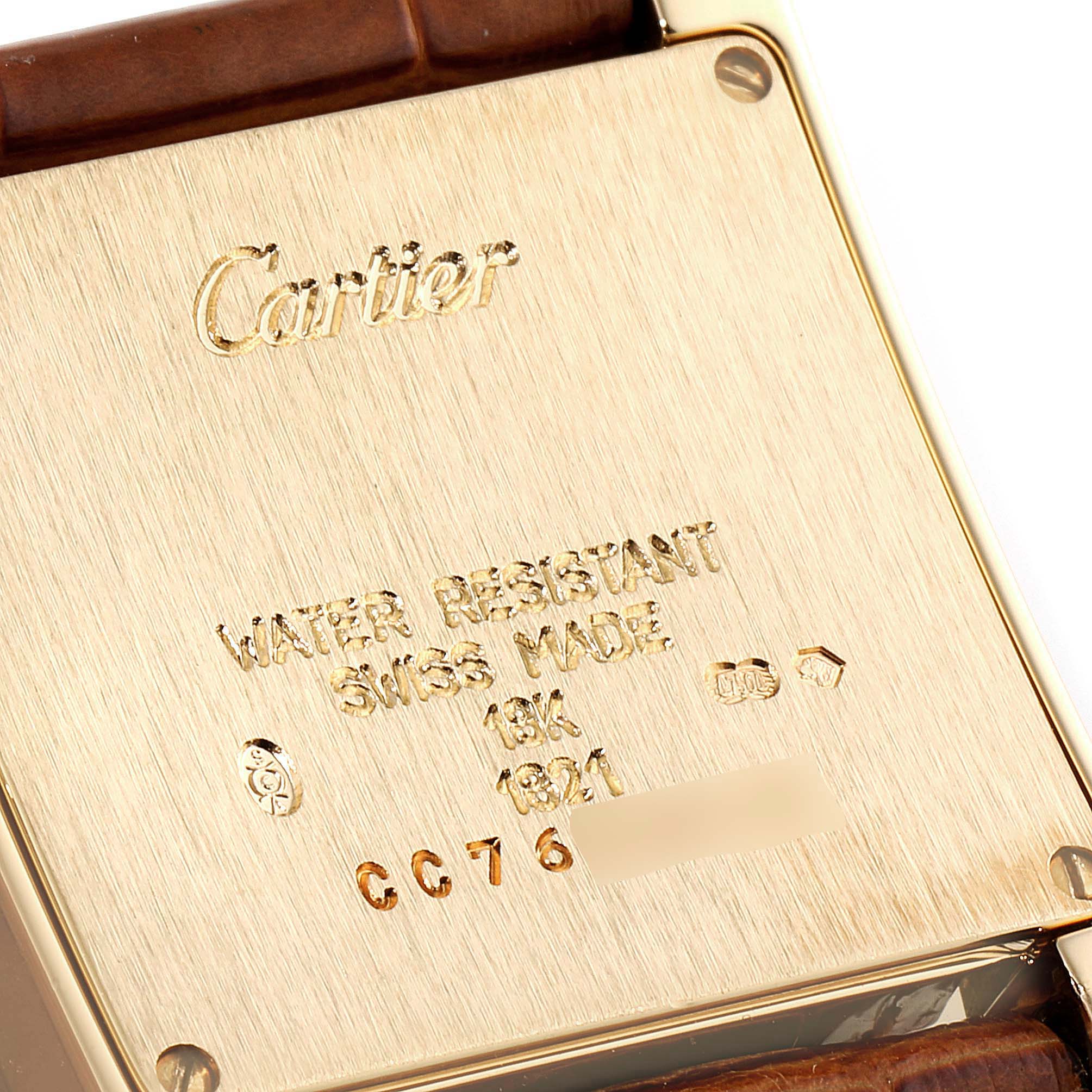 This image shows the back case of a Cartier Tank Francaise W5000356 Women
s Yellow Gold Silver Dial W5000356 Women
s Yellow Gold Silver Dial watch, displaying brand engraving and model specifications.